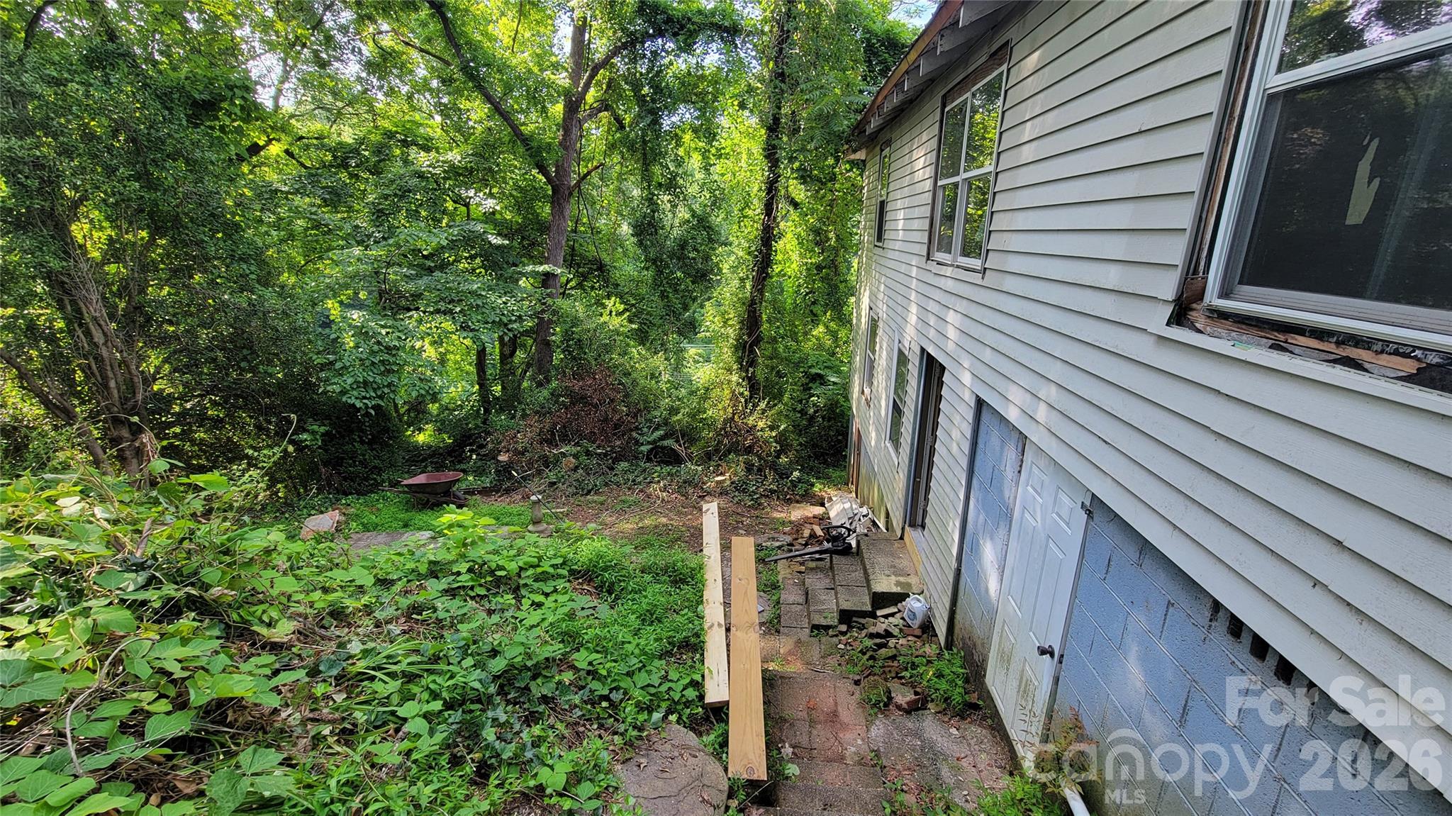 160 Cleveland Road Tryon, NC 28782 - Photo 17 of 40 a view of a backyard with pathway