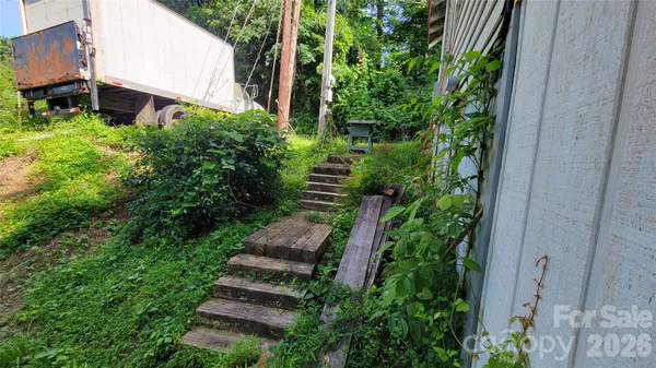 an aerial view of a house with a yard and garden