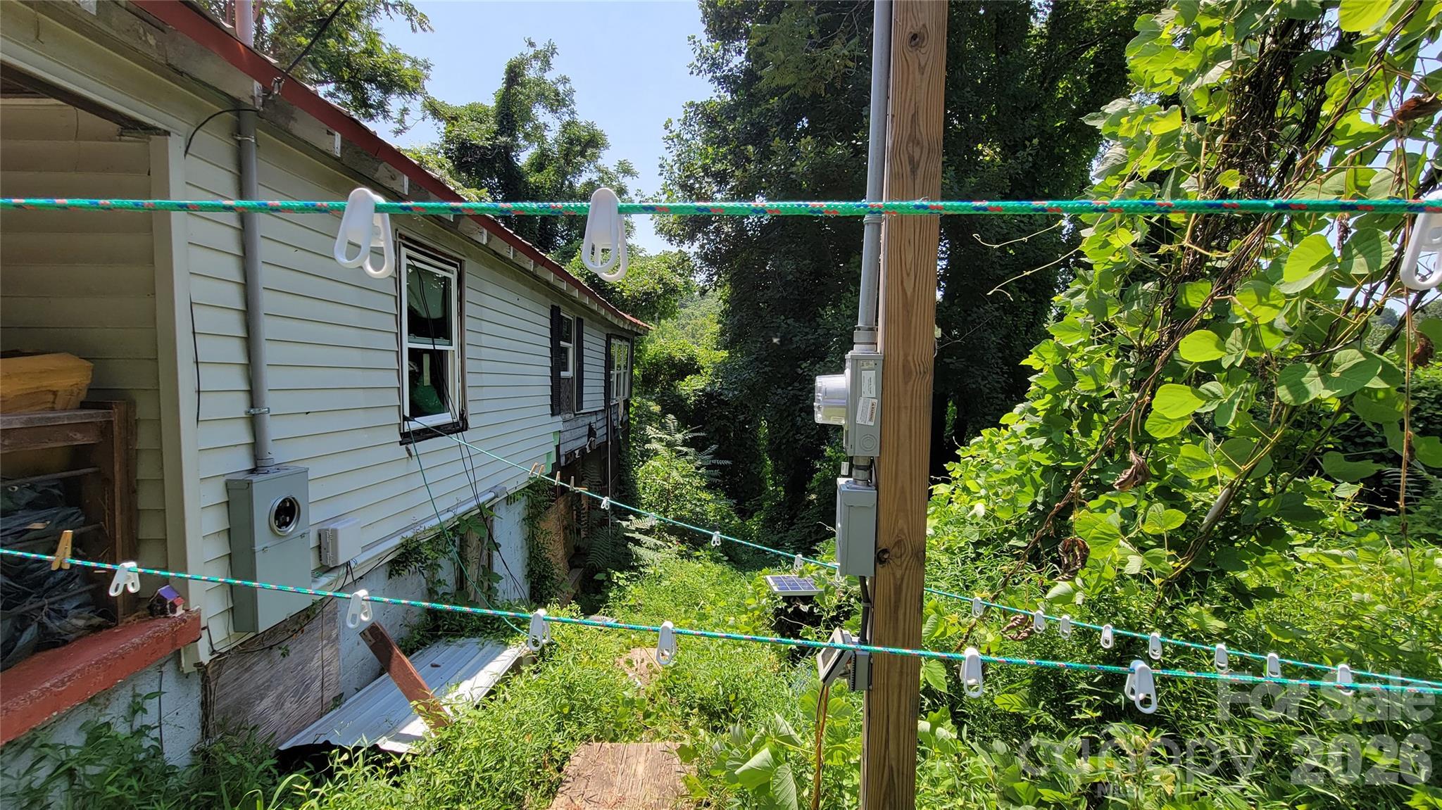 160 Cleveland Road Tryon, NC 28782 - Photo 25 of 40 a view of a house with a small yard