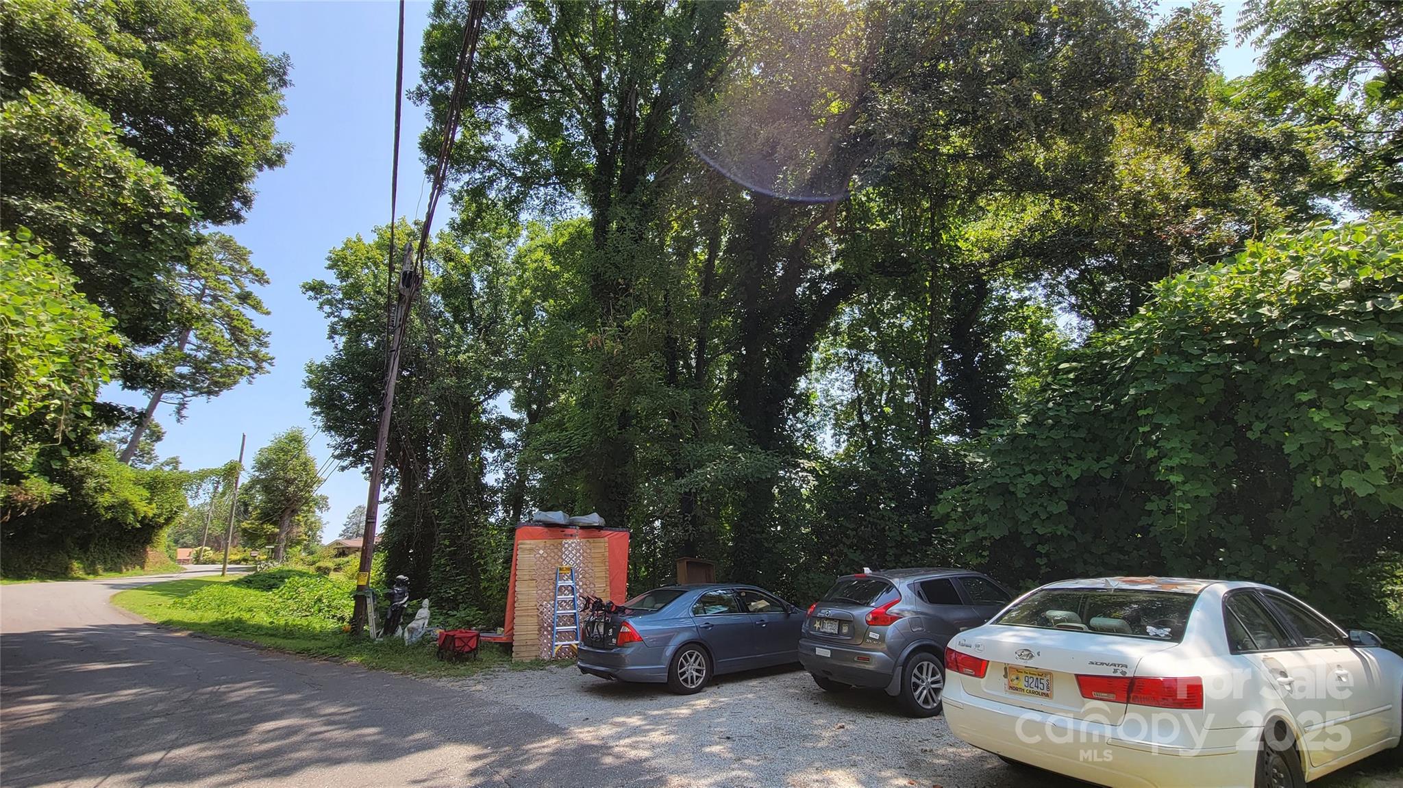 160 Cleveland Road Tryon, NC 28782 - Photo 26 of 42 a front view of a house with cars parked on the roadside