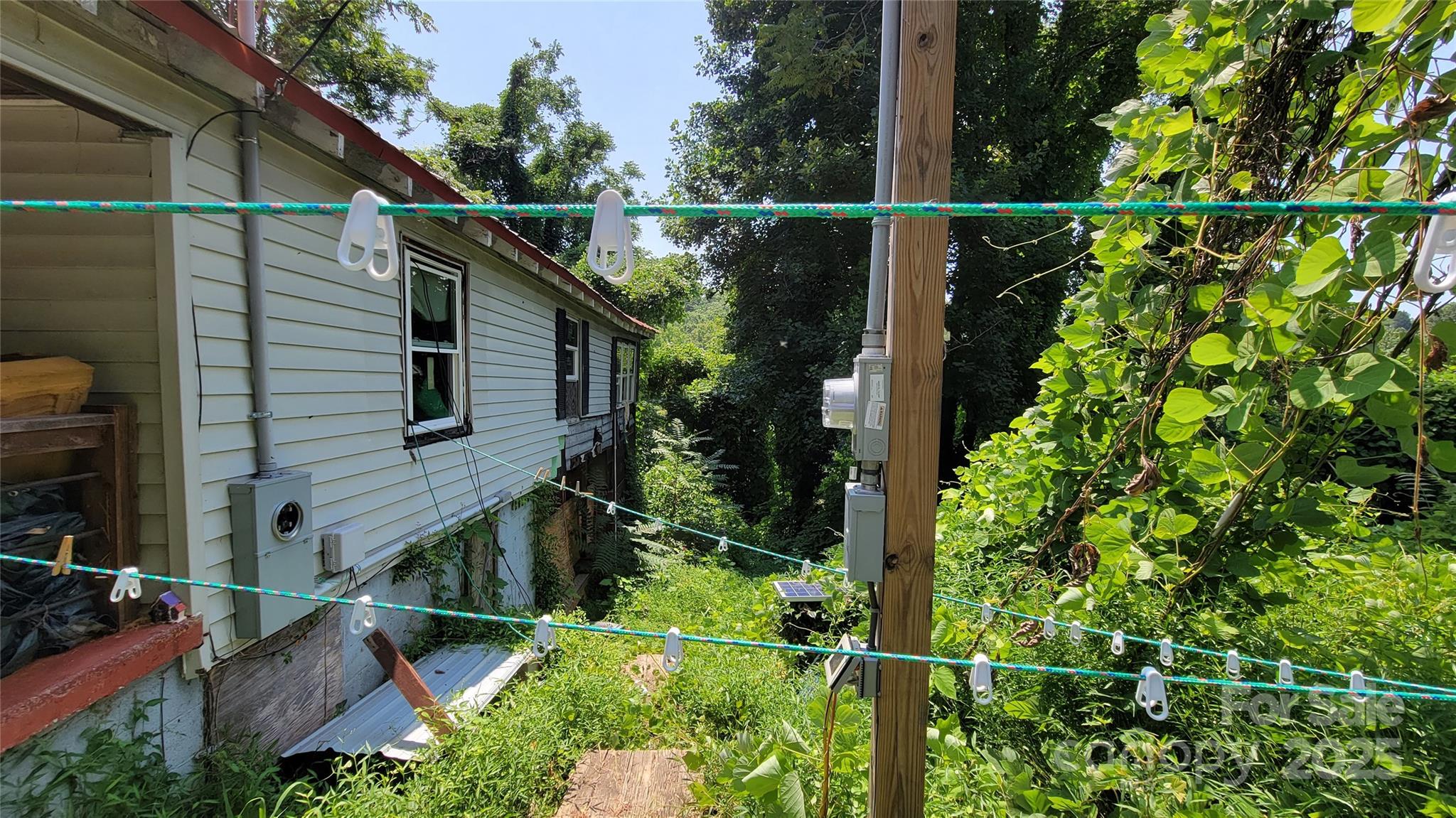 160 Cleveland Road Tryon, NC 28782 - Photo 27 of 42 a view of a house with a small yard
