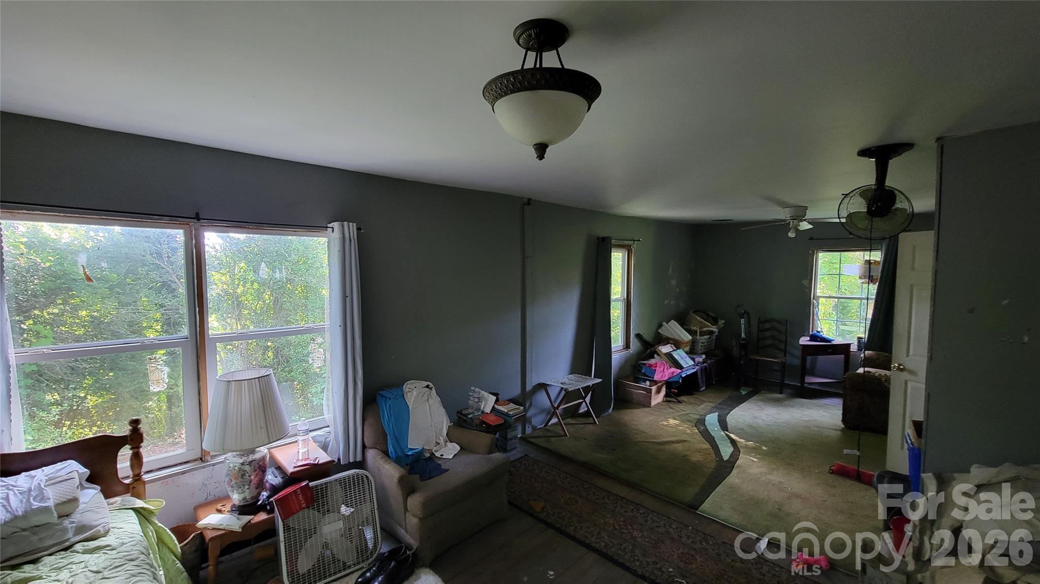 160 Cleveland Road Tryon, NC 28782 - Photo 6 of 40 a living room with furniture gym equipment and a large window