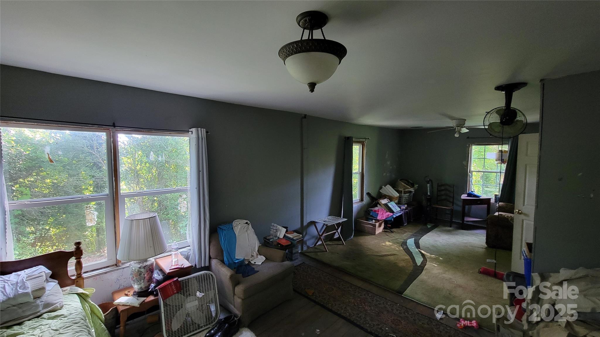 160 Cleveland Road Tryon, NC 28782 - Photo 8 of 42 a living room with furniture gym equipment and a large window
