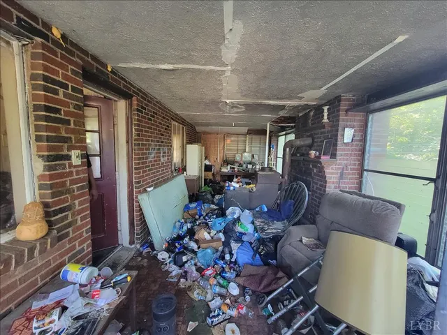 a living room with furniture ceiling fan and a rug