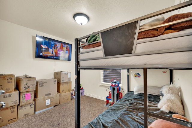 2026 Cres Drive South Mapleton, UT 84664 - Photo 11 of 18 Bedroom featuring carpet flooring and a textured ceiling