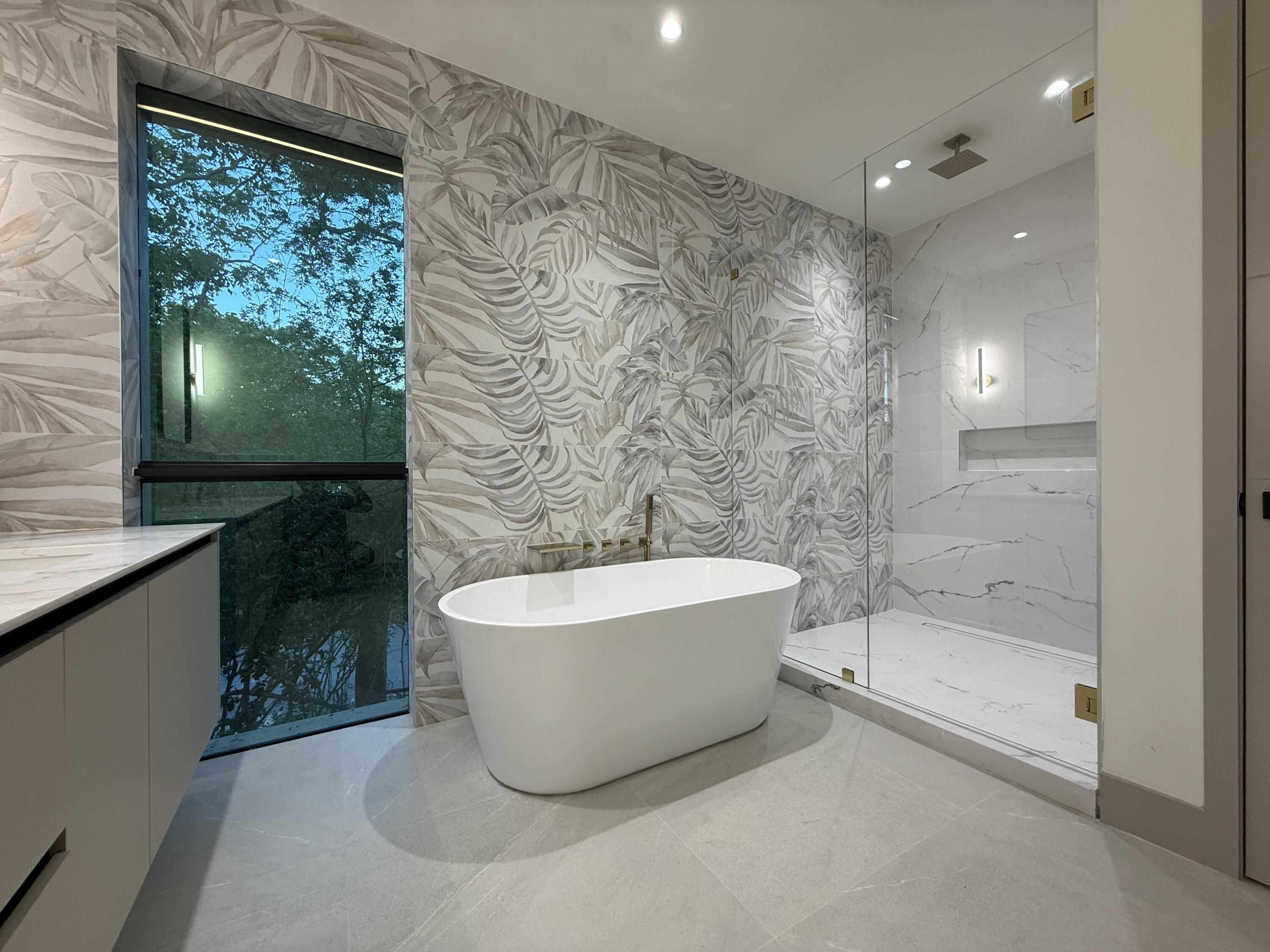 109 Point Pleasant Drive Key Largo, FL 33037 - Photo 26 of 58 a bathroom with a bathtub and shower