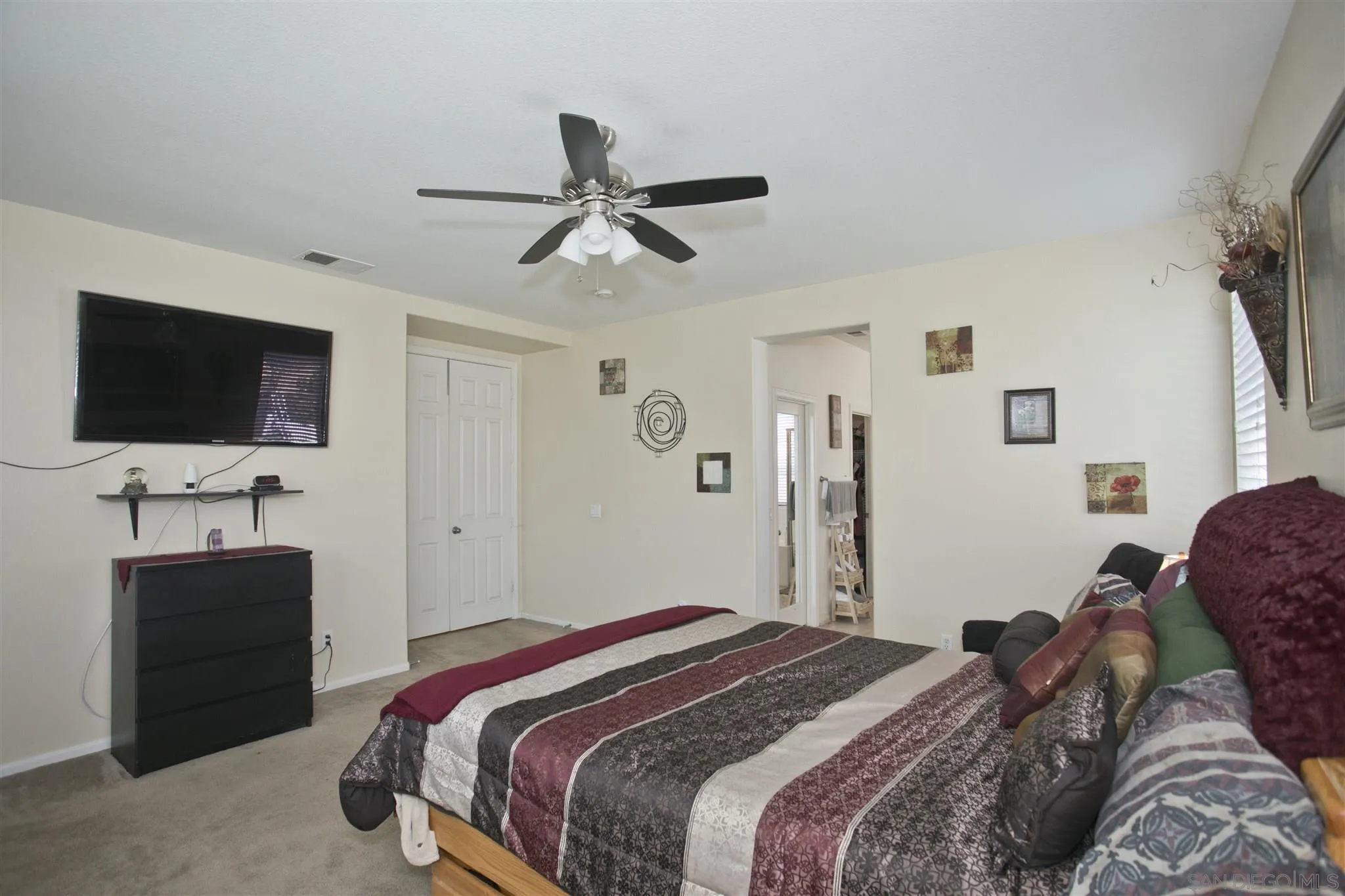 4660 Duskywing Road Hemet, CA 92545 - Photo 13 of 29 a bedroom with a bed and a flat screen tv