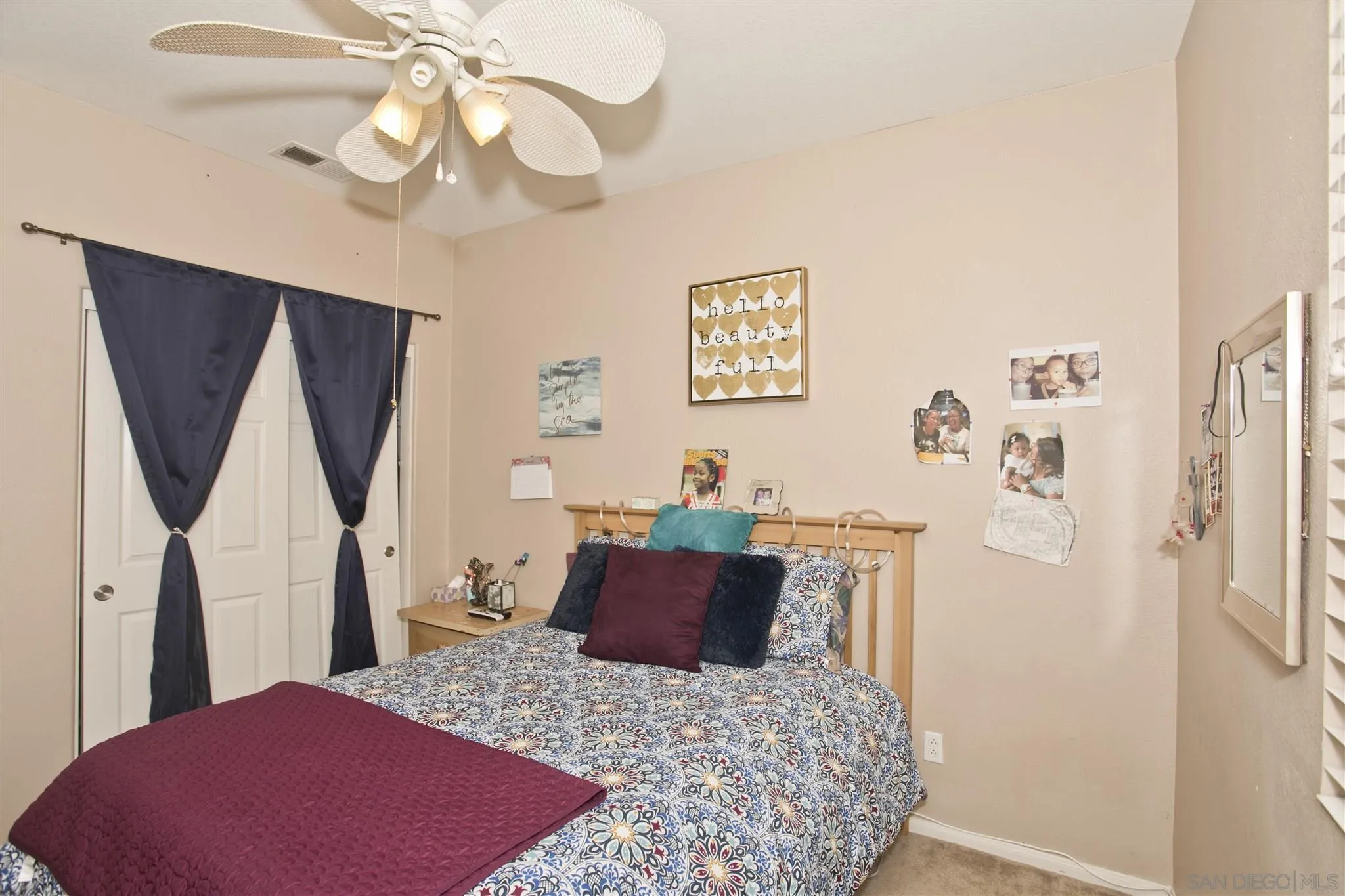 4660 Duskywing Road Hemet, CA 92545 - Photo 21 of 29 a bed room with a bed and a chandelier