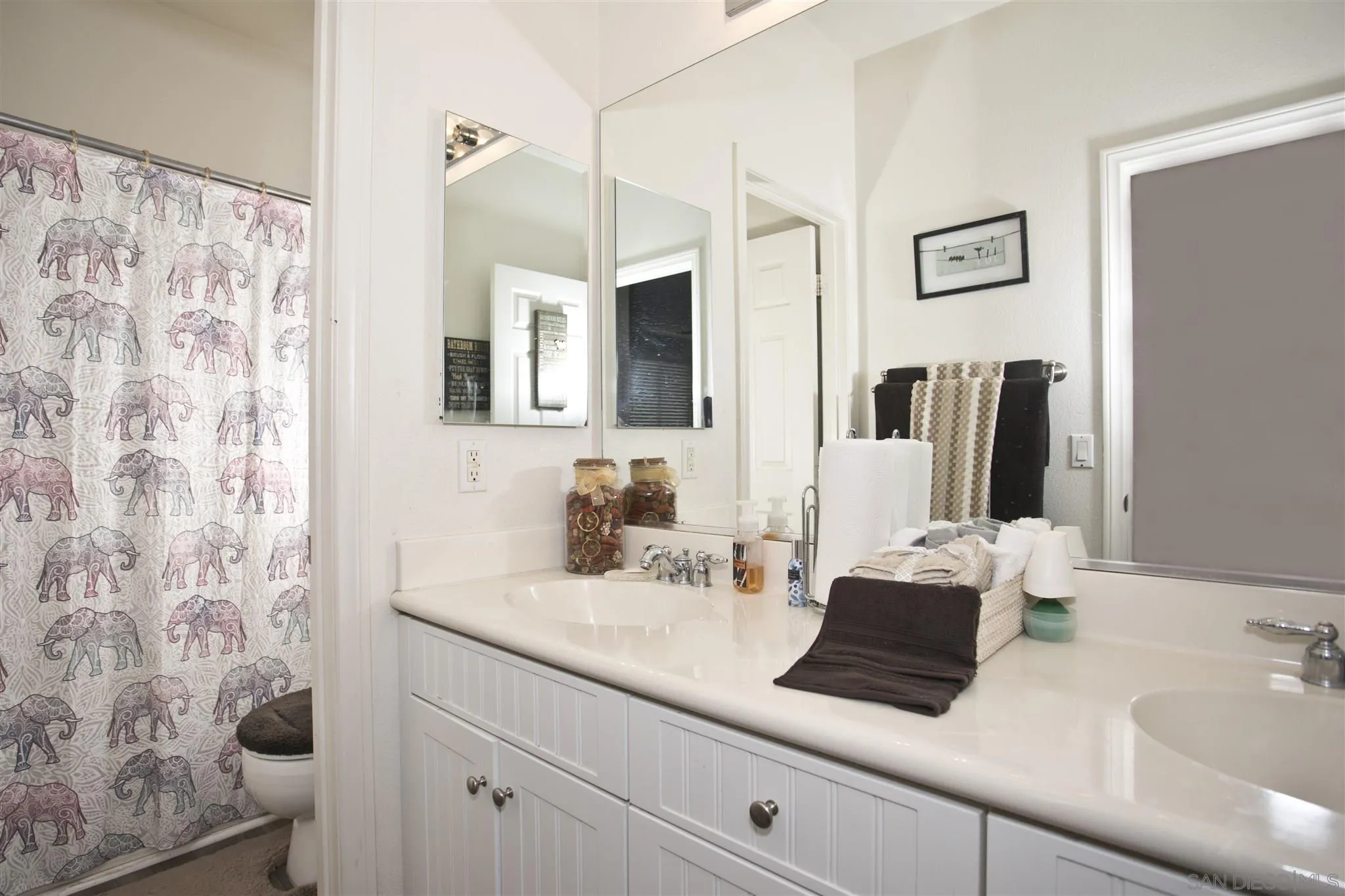 4660 Duskywing Road Hemet, CA 92545 - Photo 22 of 29 a bathroom with a sink double vanity and a mirror