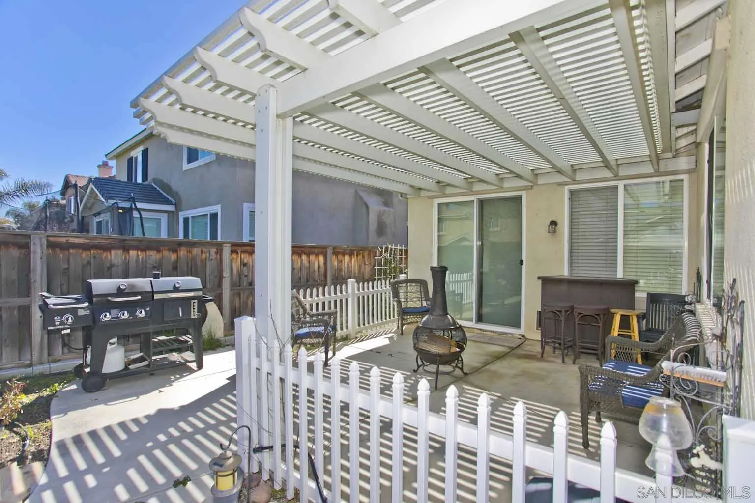 4660 Duskywing Road Hemet, CA 92545 - Photo 25 of 29 a view of a patio with couches chairs and wooden floor