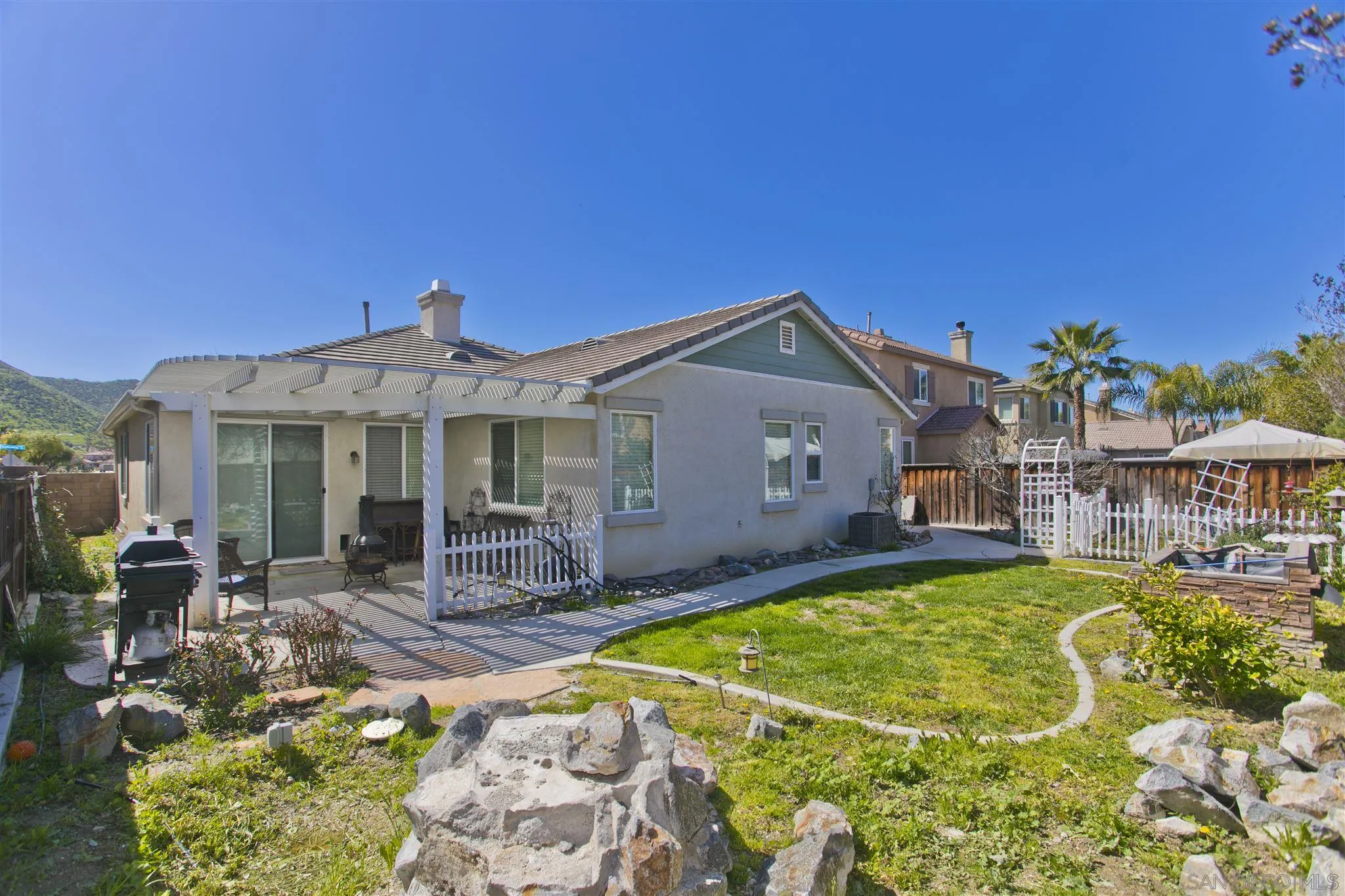 4660 Duskywing Road Hemet, CA 92545 - Photo 27 of 29 a view of a house with swimming pool and sitting area