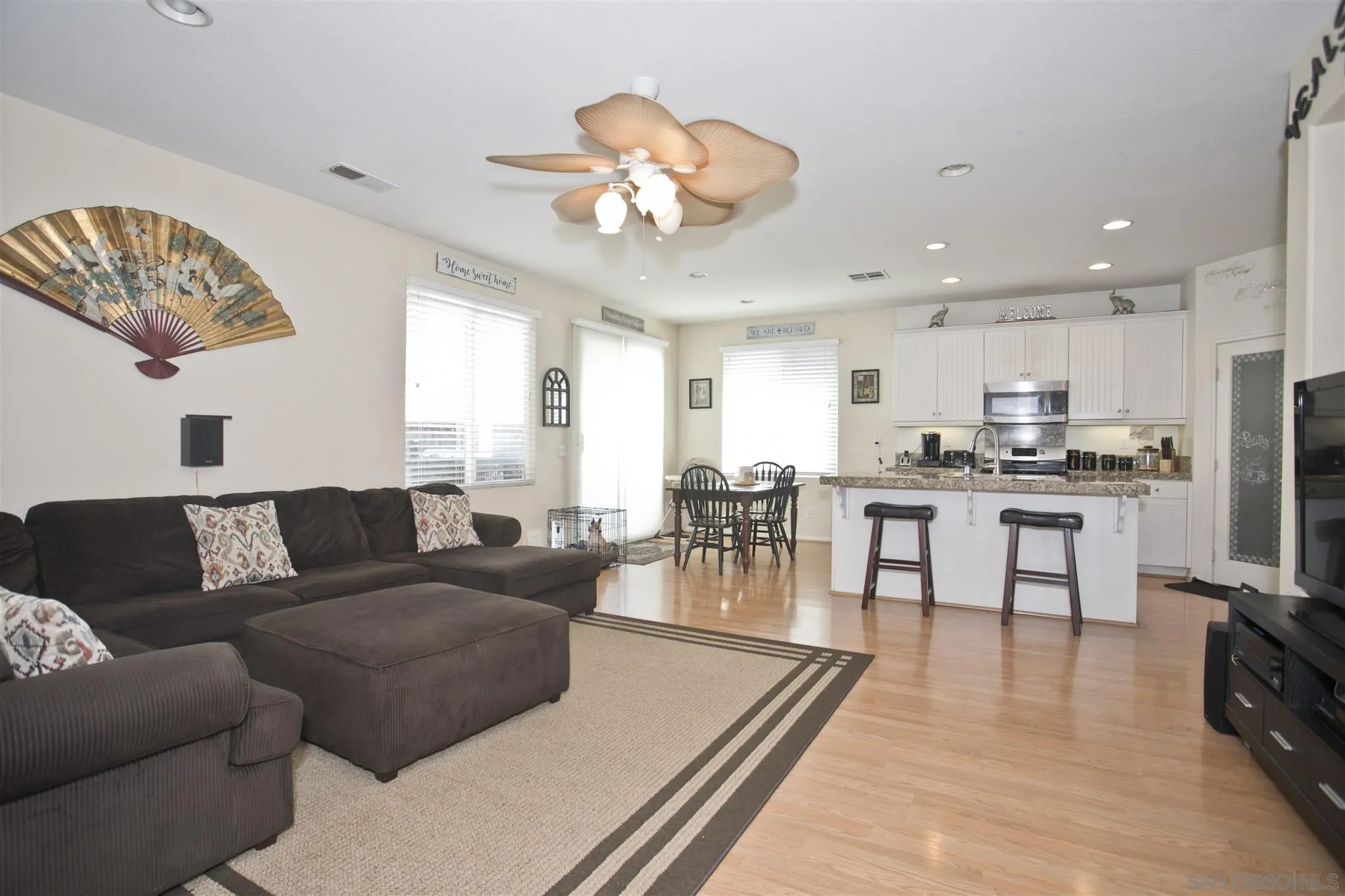 4660 Duskywing Road Hemet, CA 92545 - Photo 7 of 29 a living room with furniture kitchen and a chandelier