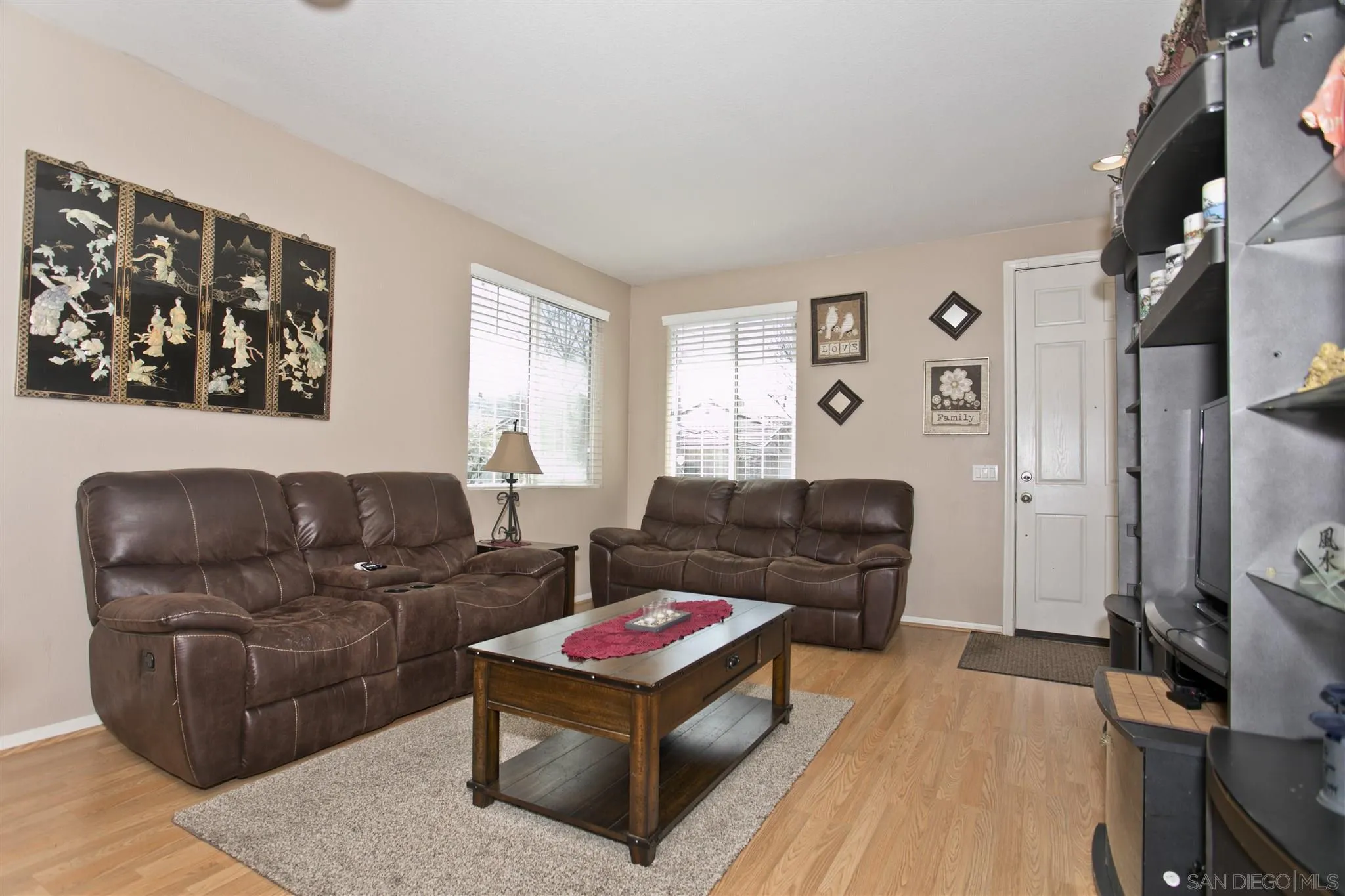 4660 Duskywing Road Hemet, CA 92545 - Photo 10 of 29 a living room with furniture and a flat screen tv