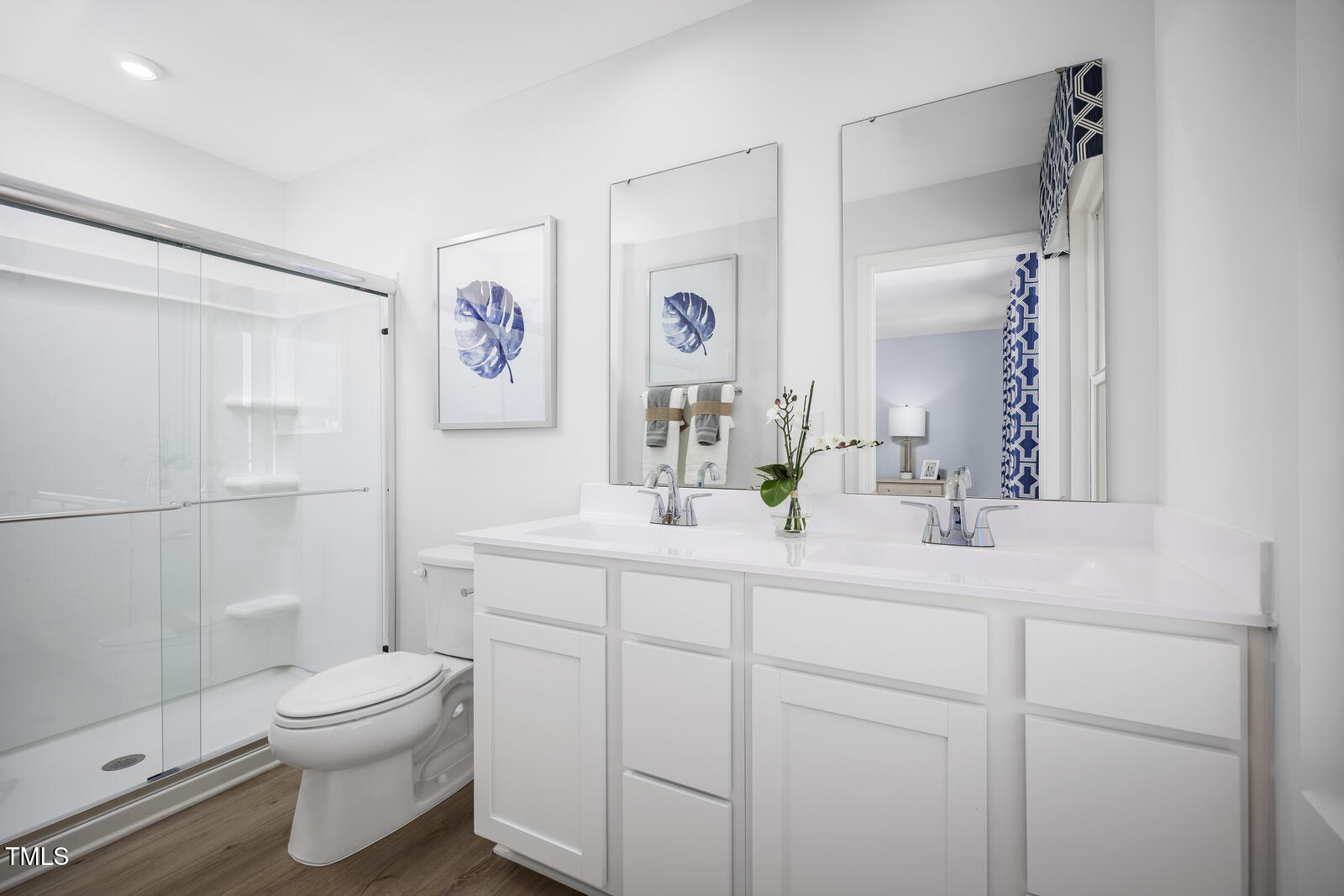 152 Cavalier Rider Run Wendell, NC 27591 - Photo 11 of 21 a bathroom with a toilet a sink a mirror a vanity and shower