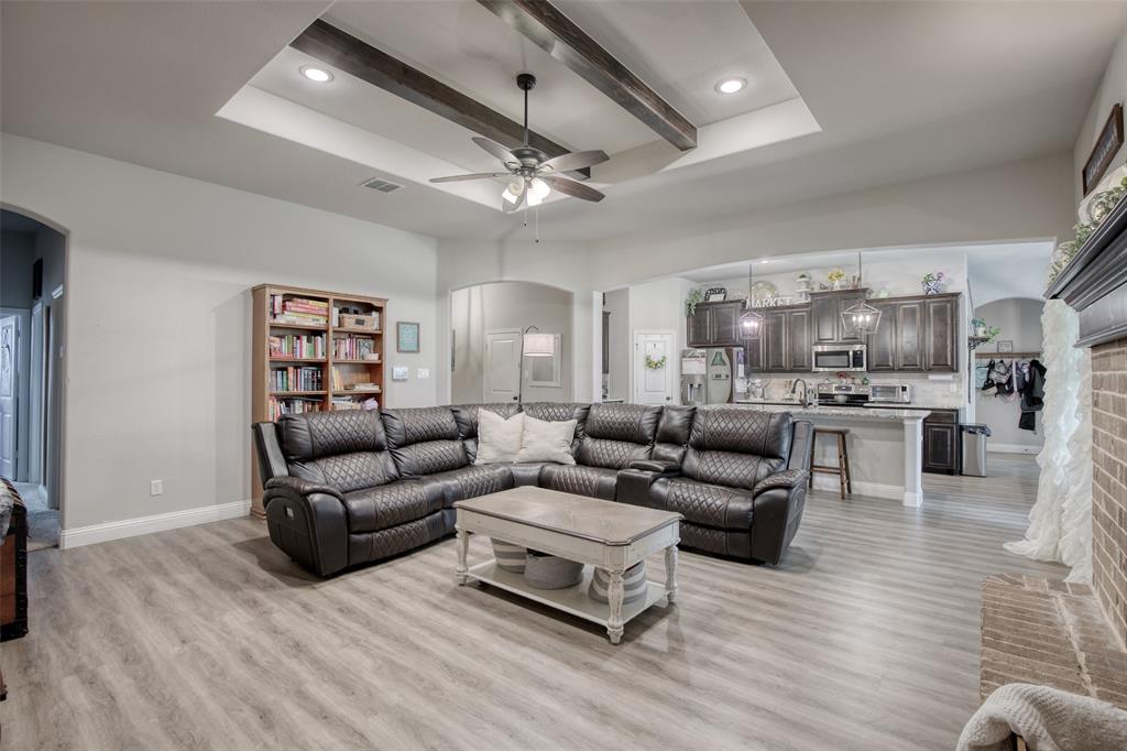 211 Rees Avenue Godley, TX 76044 - Photo 4 of 18 a living room with furniture and a wooden floor