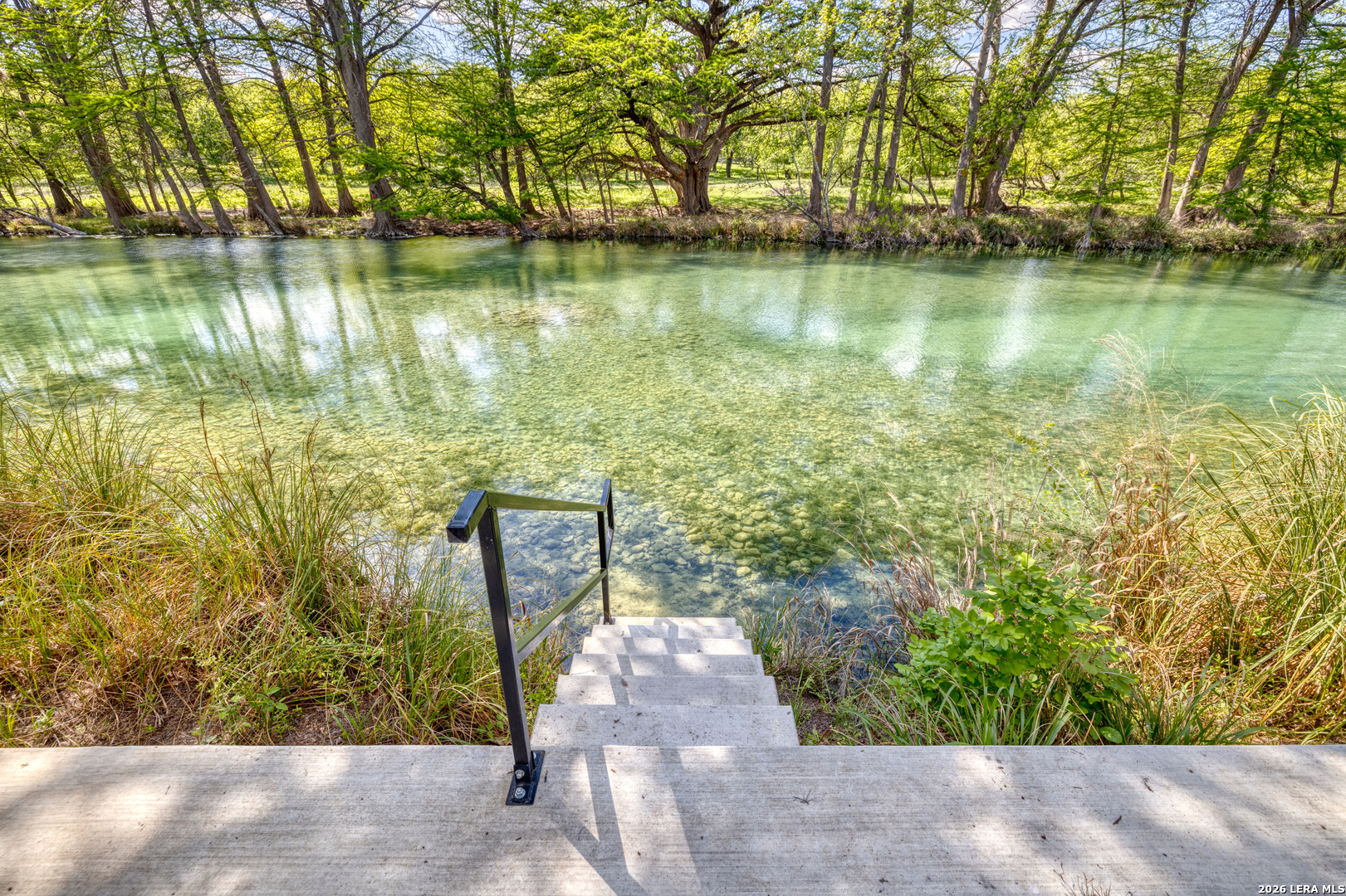 869 Ridge Loop Rio Frio, TX 78879 - Photo 13 of 40 a view of a lake with a big yard