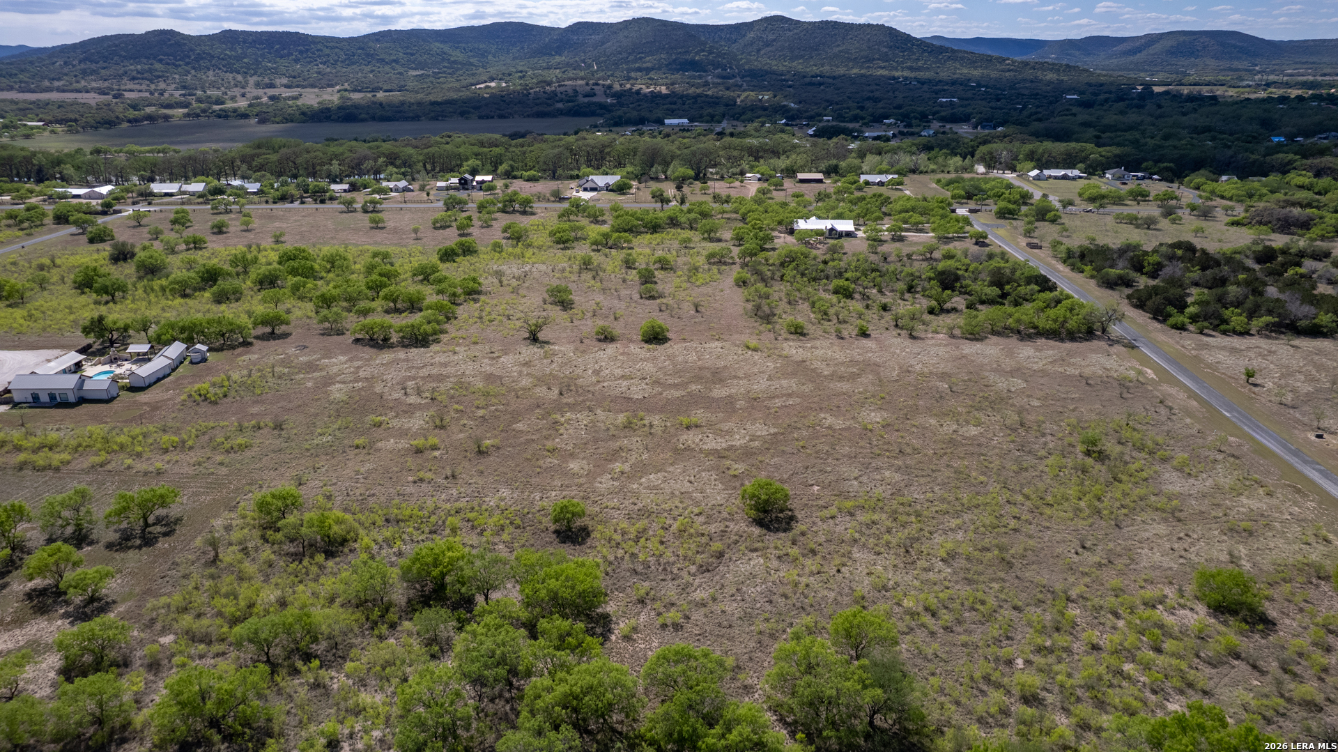 869 Ridge Loop Rio Frio, TX 78879 - Photo 17 of 40 a view of a lush green hillside and houses
