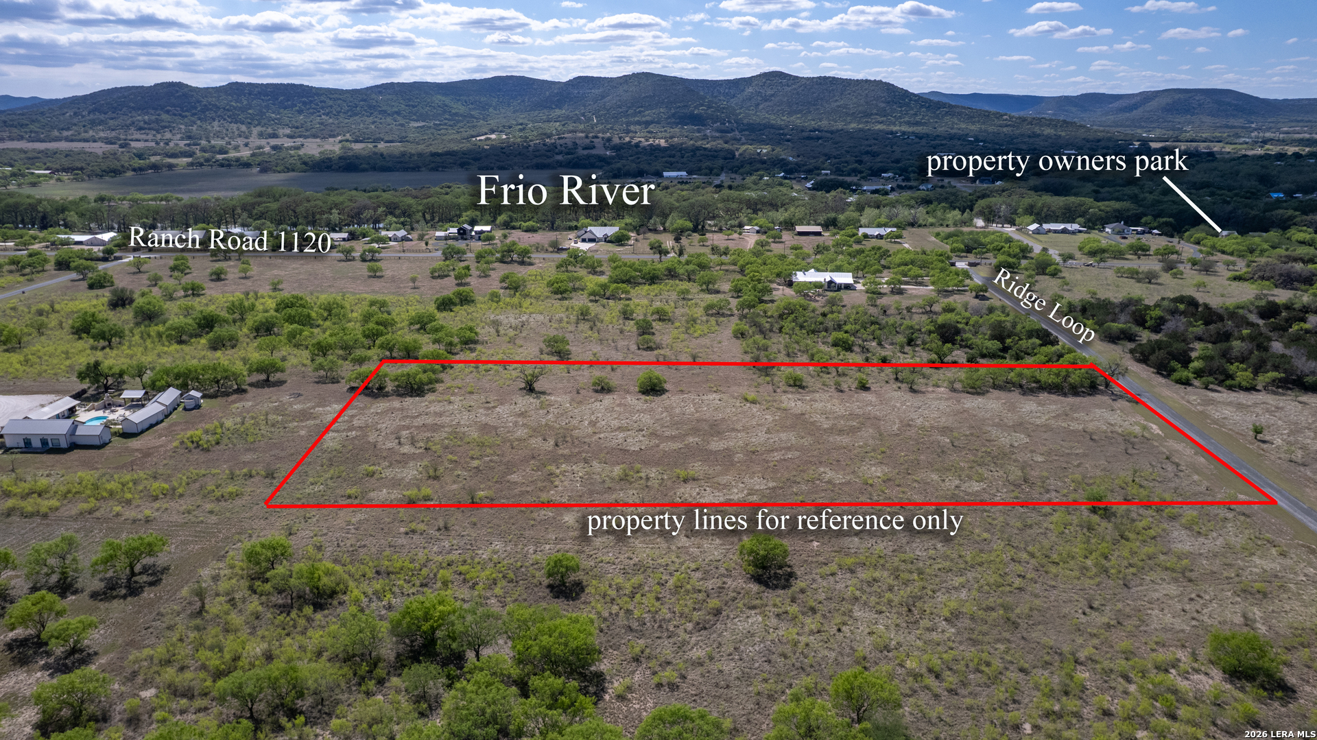 869 Ridge Loop Rio Frio, TX 78879 - Photo 2 of 40 a view of multiple houses with a road