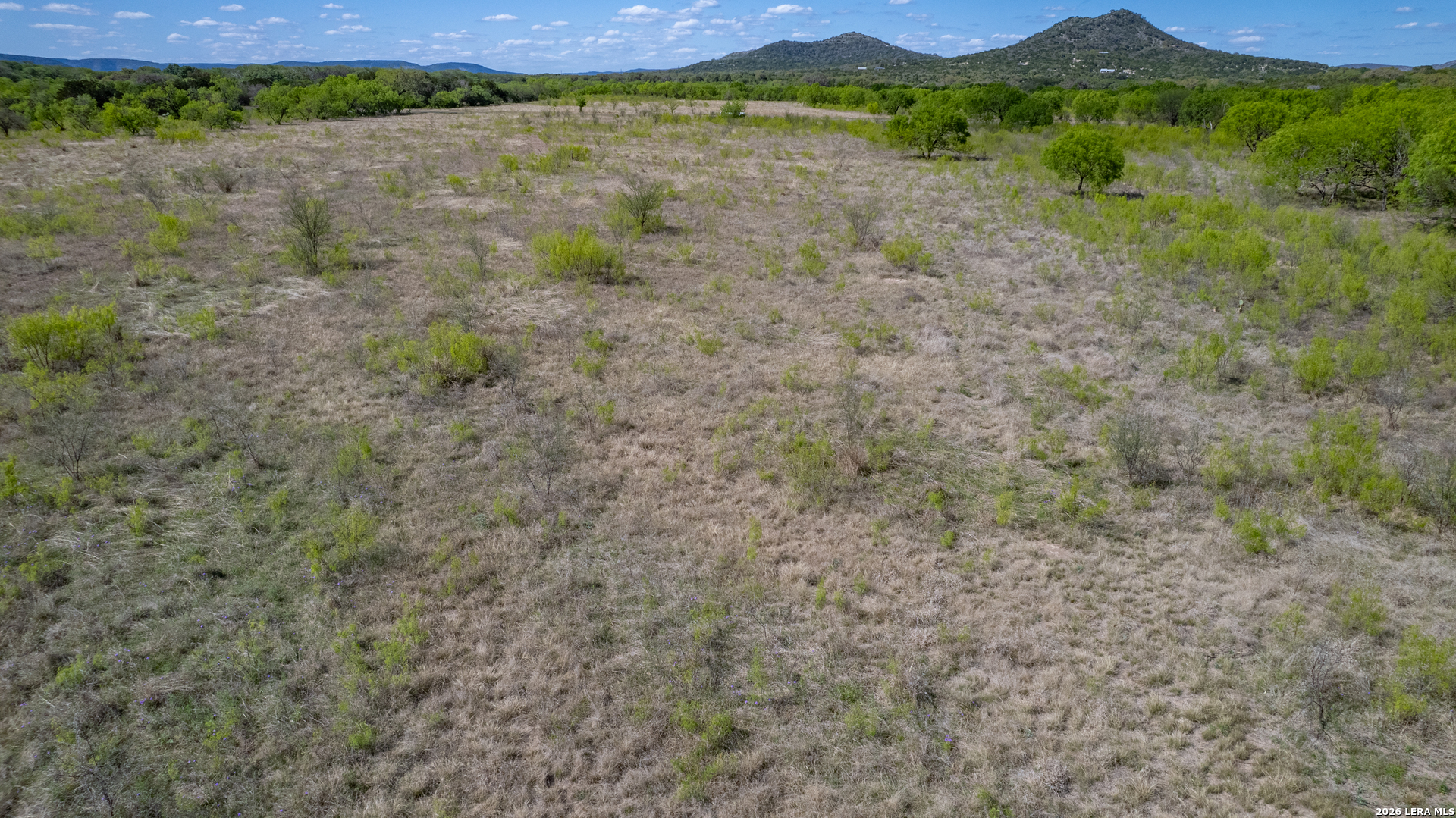 869 Ridge Loop Rio Frio, TX 78879 - Photo 21 of 40 a view of a lake with mountains in the background