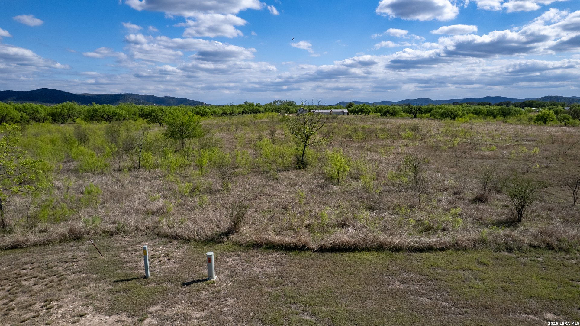 869 Ridge Loop Rio Frio, TX 78879 - Photo 25 of 40 a view of a yard with a brick wall