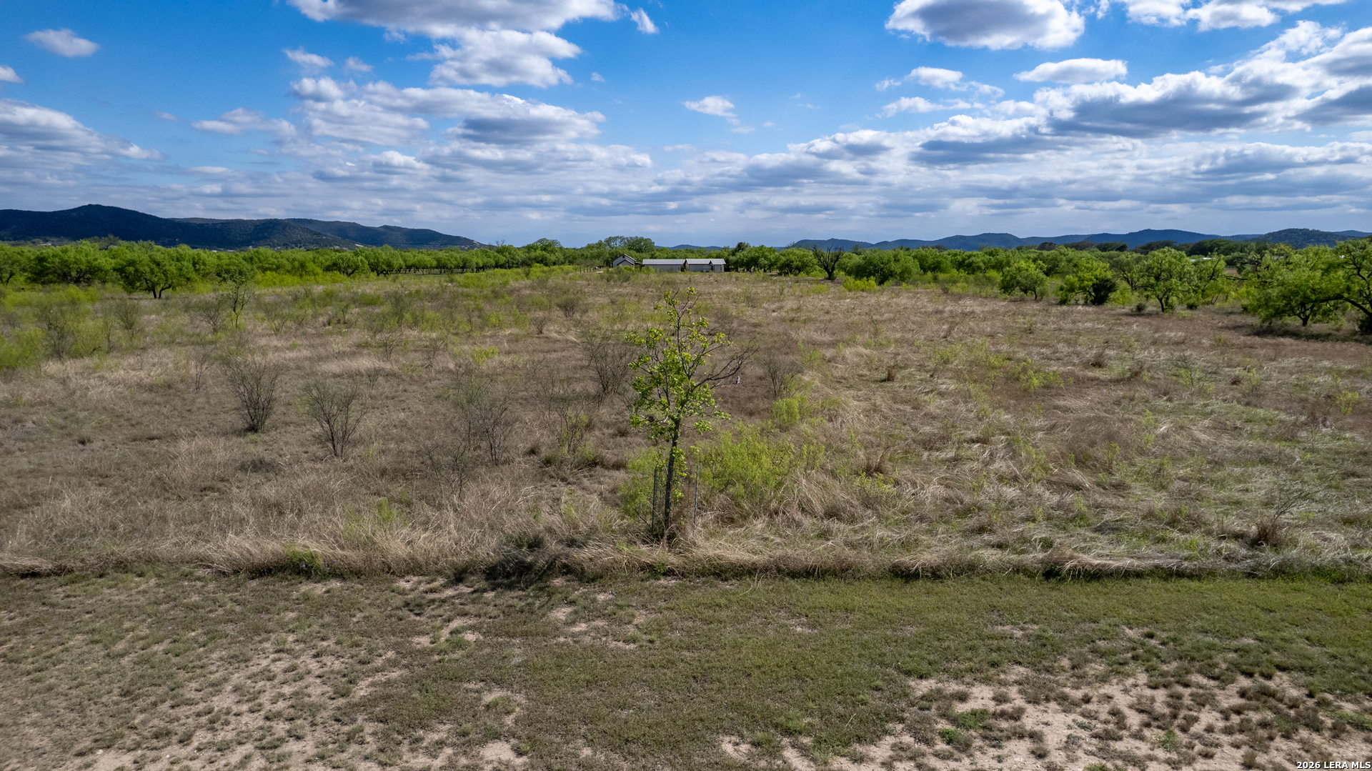 869 Ridge Loop Rio Frio, TX 78879 - Photo 26 of 40 a view of a lake with a house