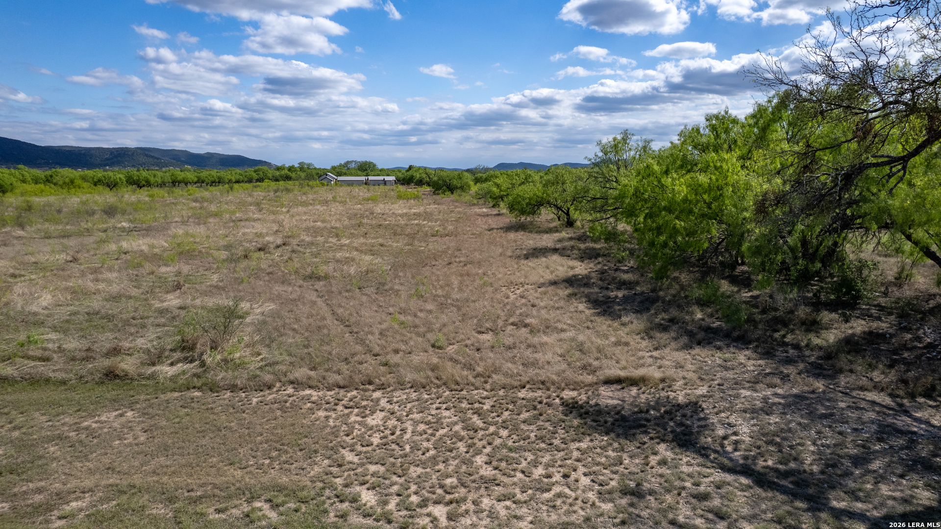 869 Ridge Loop Rio Frio, TX 78879 - Photo 27 of 40 a view of a yard with a house in the background