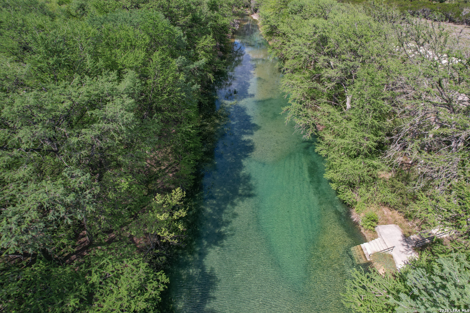 869 Ridge Loop Rio Frio, TX 78879 - Photo 36 of 40 a view of a lake with huge green field and trees