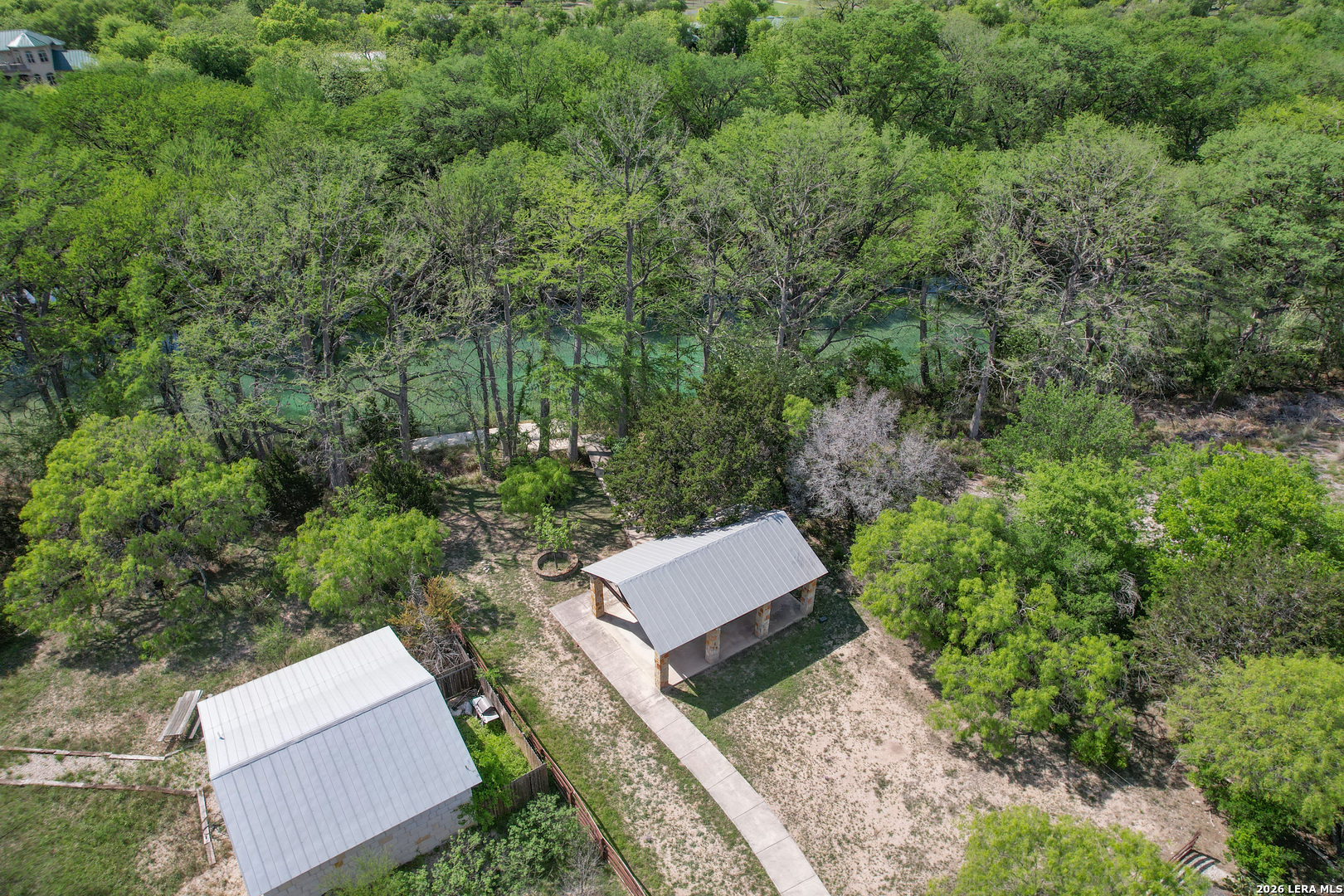 869 Ridge Loop Rio Frio, TX 78879 - Photo 38 of 40 an aerial view of a house with yard and outdoor seating