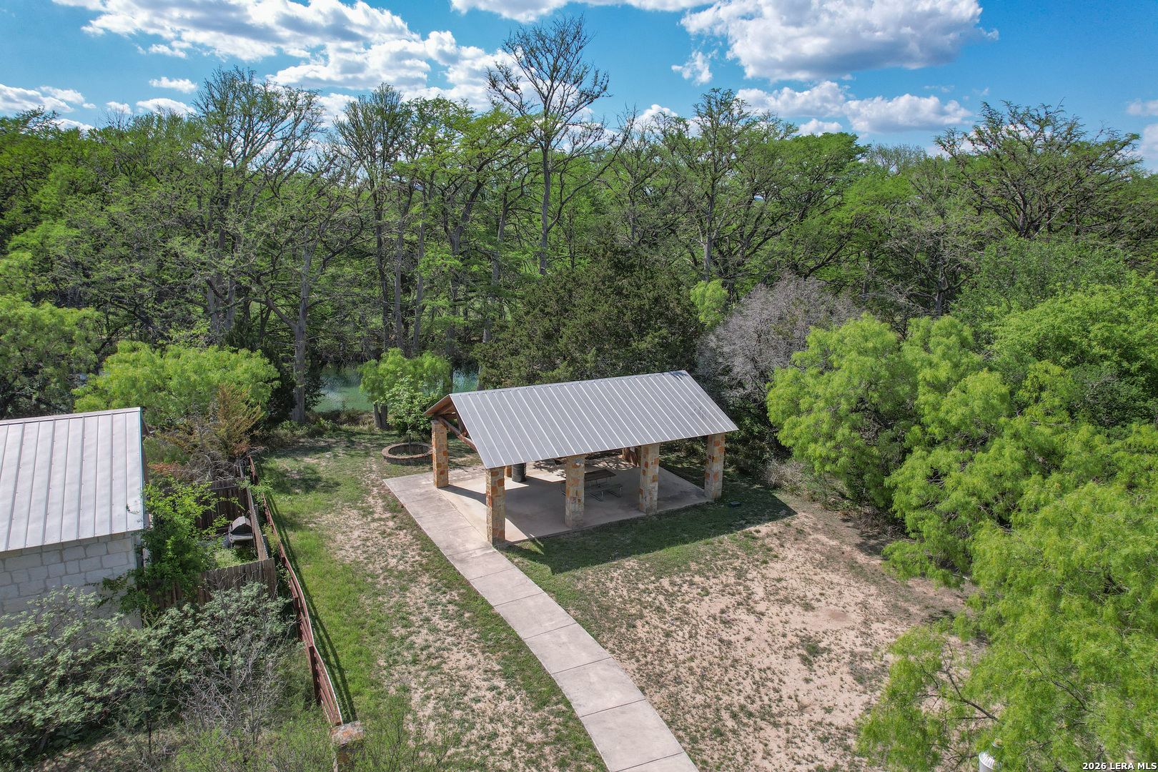 869 Ridge Loop Rio Frio, TX 78879 - Photo 40 of 40 an aerial view of a house with yard and mountain view in back