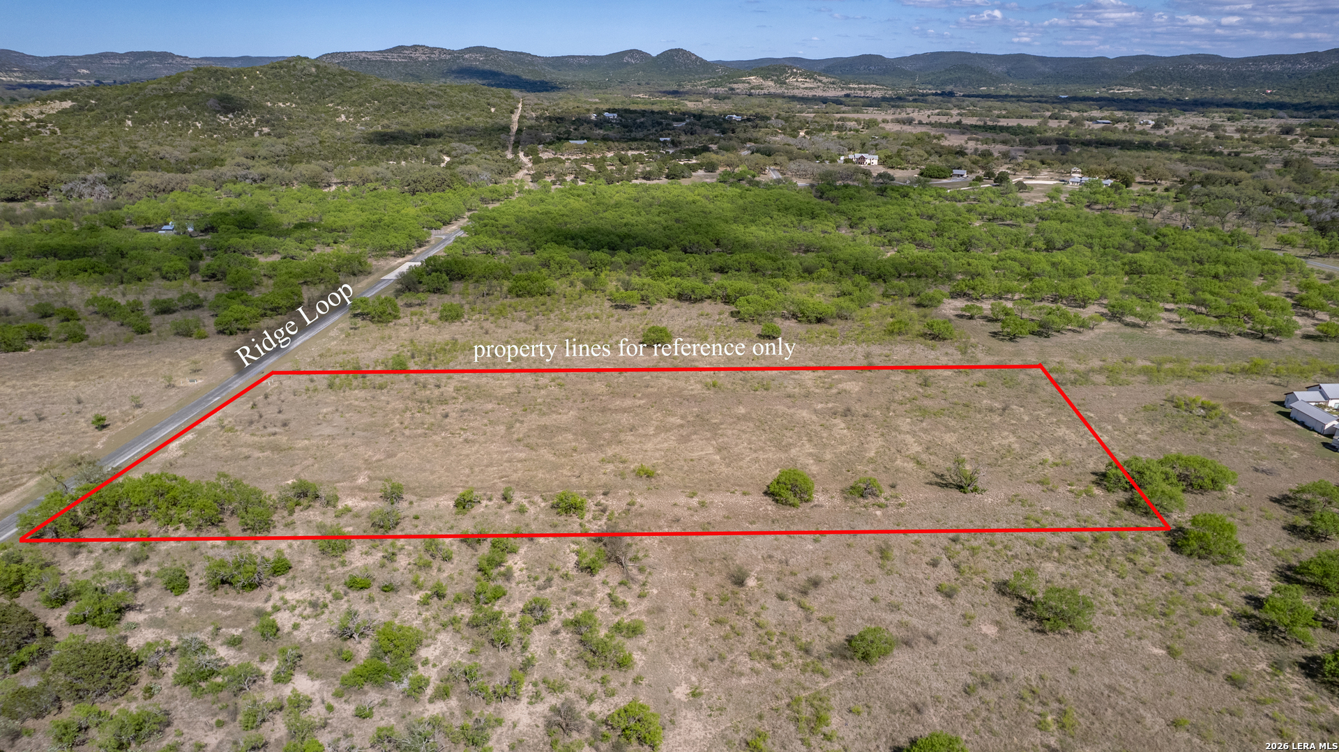 869 Ridge Loop Rio Frio, TX 78879 - Photo 5 of 40 a view of a dry yard with green space