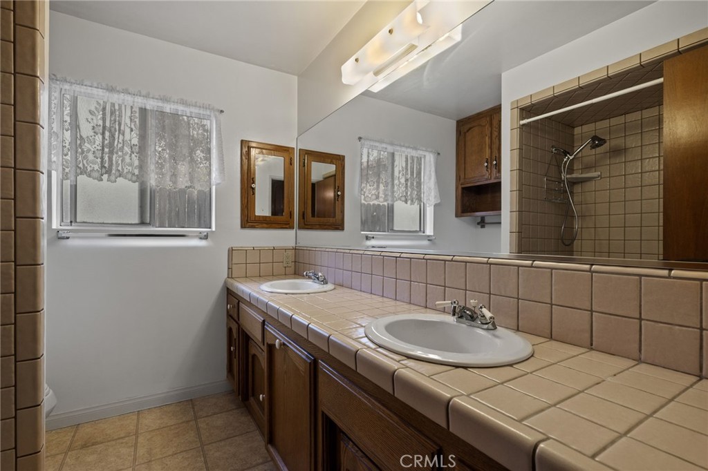 2065 Jenkins Road Bakersfield, CA 93314 - Photo 32 of 59 a bathroom with a sink and a mirror