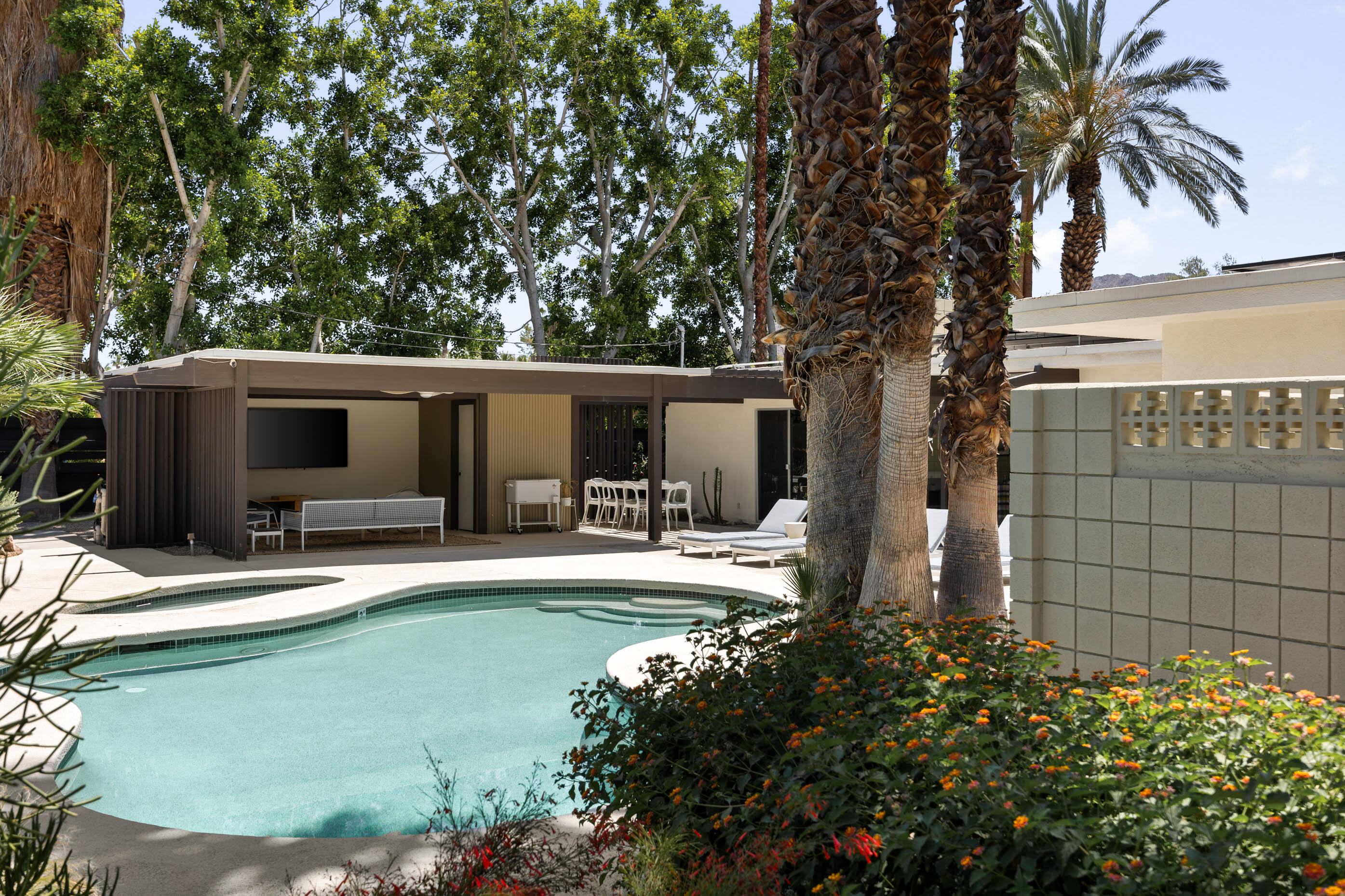 74110 Covered Wagon Trail Palm Desert, CA 92260 - Photo 12 of 44 a view of a house with backyard and sitting area