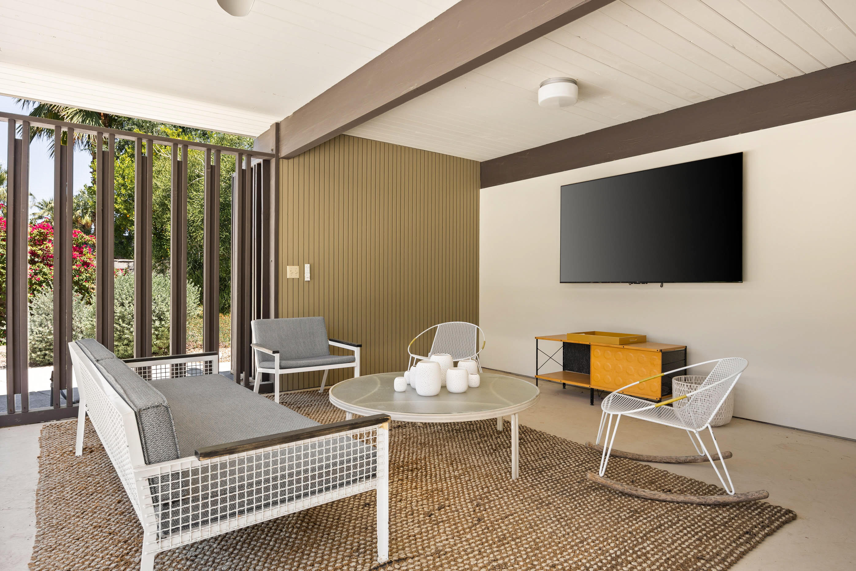 74110 Covered Wagon Trail Palm Desert, CA 92260 - Photo 14 of 44 a living room with furniture and a flat screen tv