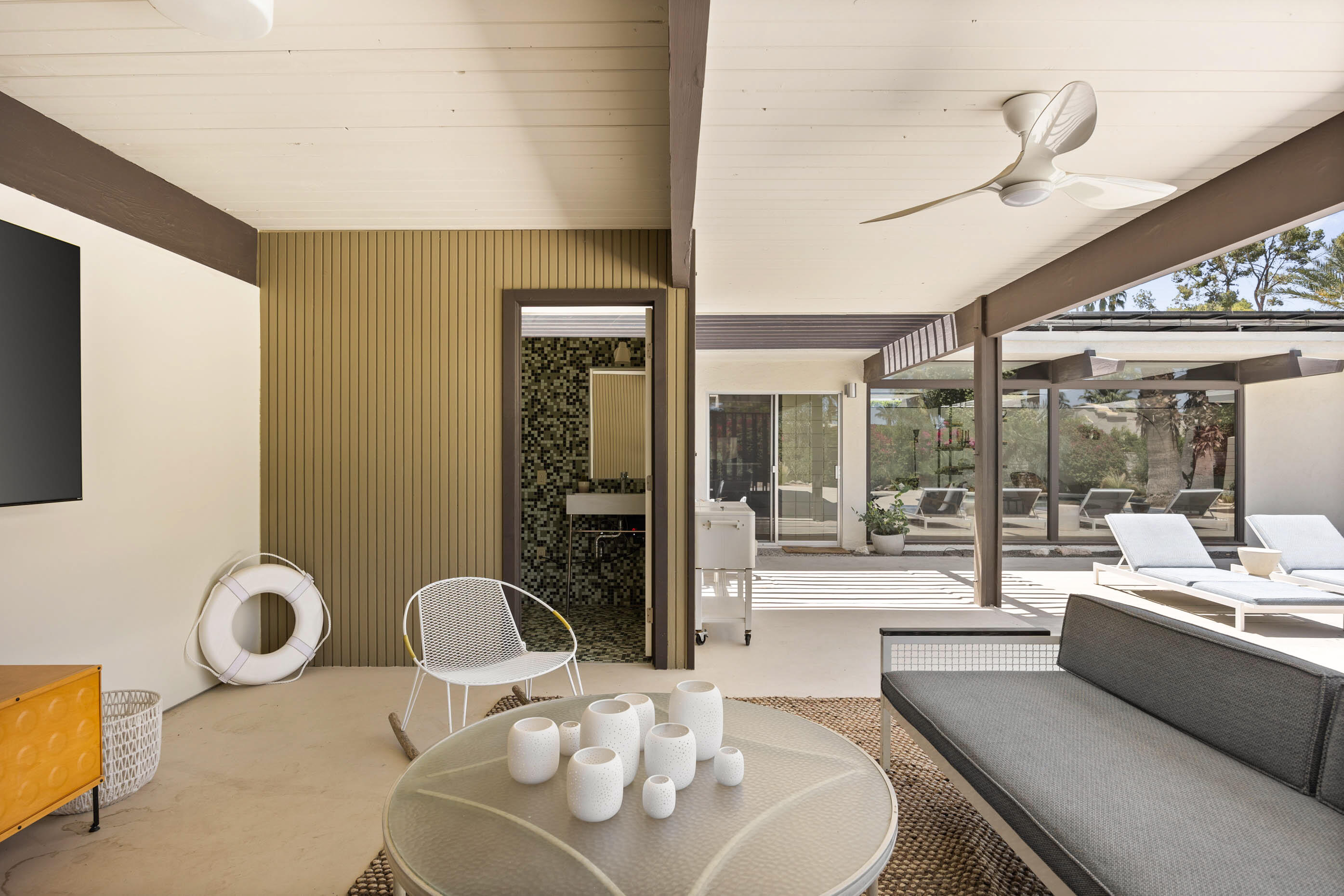 74110 Covered Wagon Trail Palm Desert, CA 92260 - Photo 16 of 44 a dining room with furniture and a large window