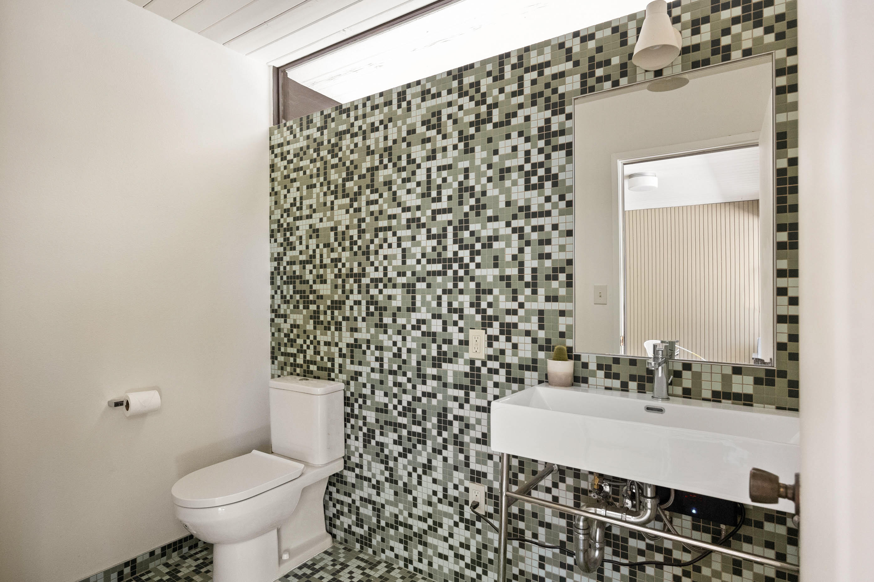 74110 Covered Wagon Trail Palm Desert, CA 92260 - Photo 17 of 44 a bathroom with a sink toilet and a mirror