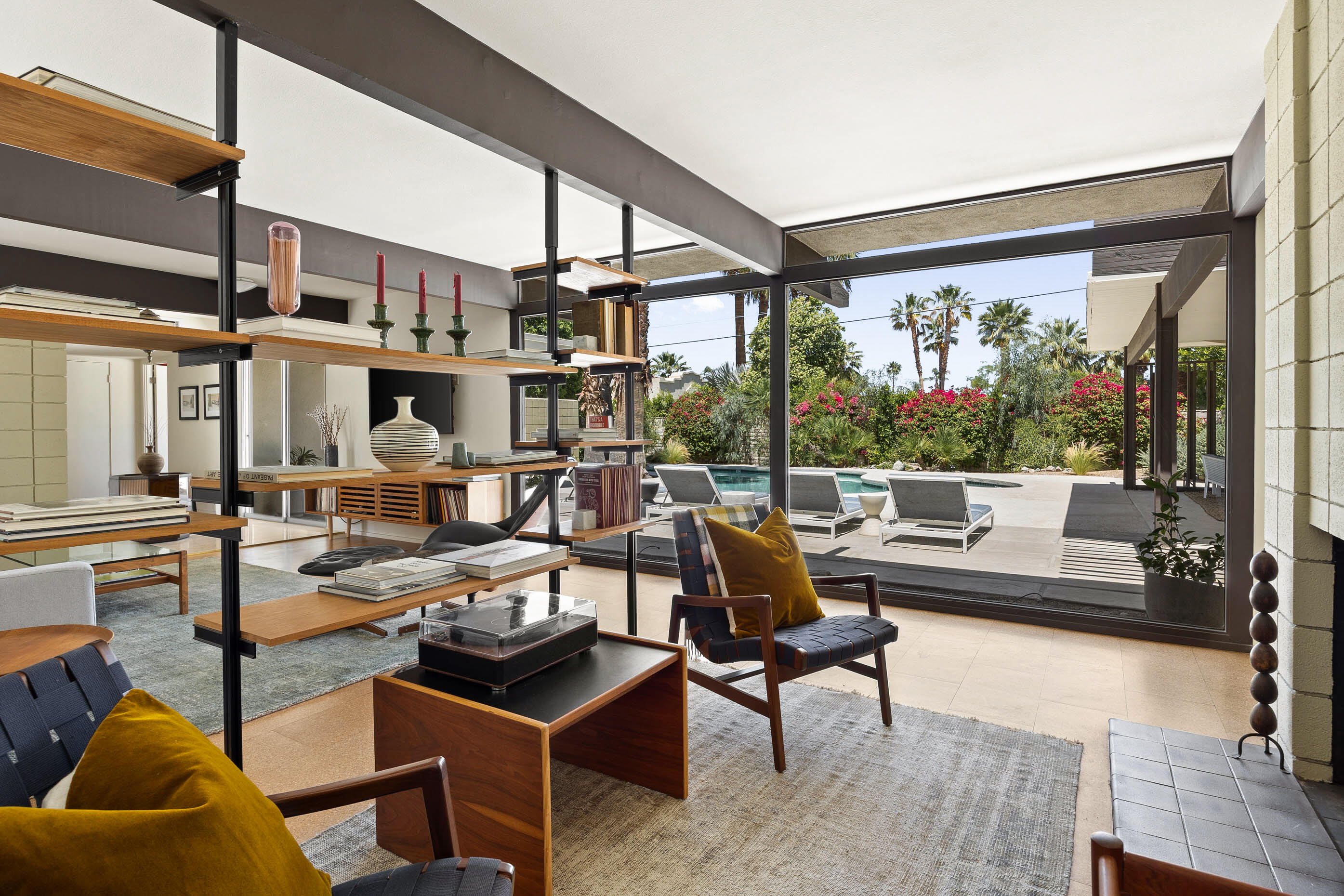 74110 Covered Wagon Trail Palm Desert, CA 92260 - Photo 24 of 44 a living room with patio furniture and a large window
