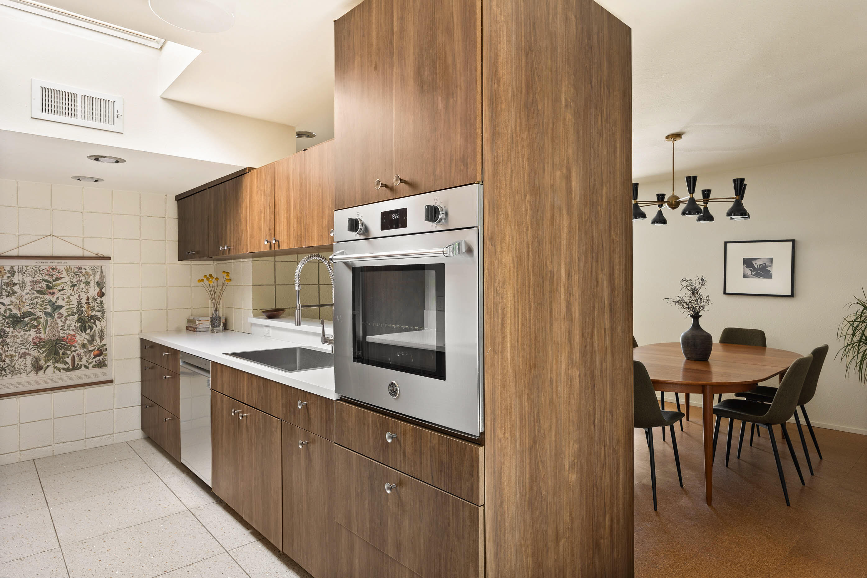 74110 Covered Wagon Trail Palm Desert, CA 92260 - Photo 30 of 44 a kitchen with stainless steel appliances a stove a sink and a refrigerator