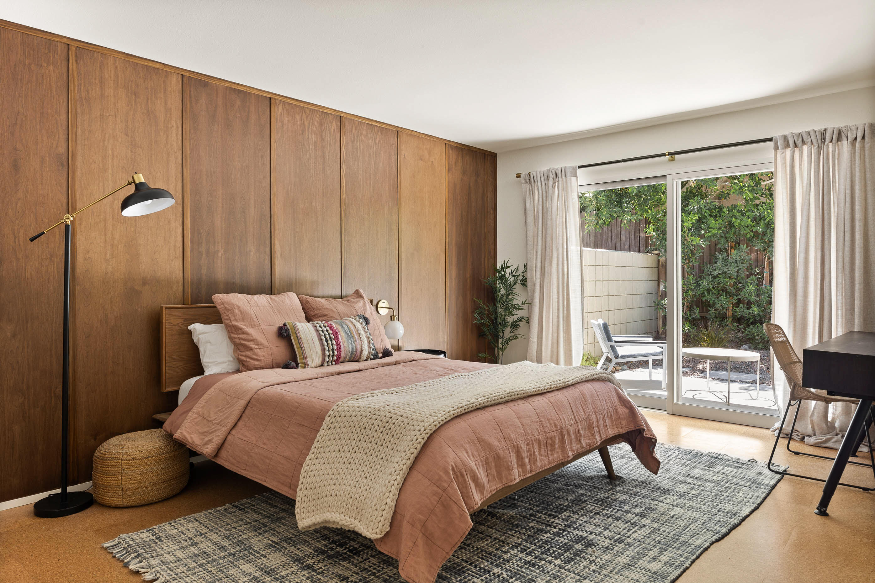 74110 Covered Wagon Trail Palm Desert, CA 92260 - Photo 31 of 44 a bedroom with a bed a table and large window