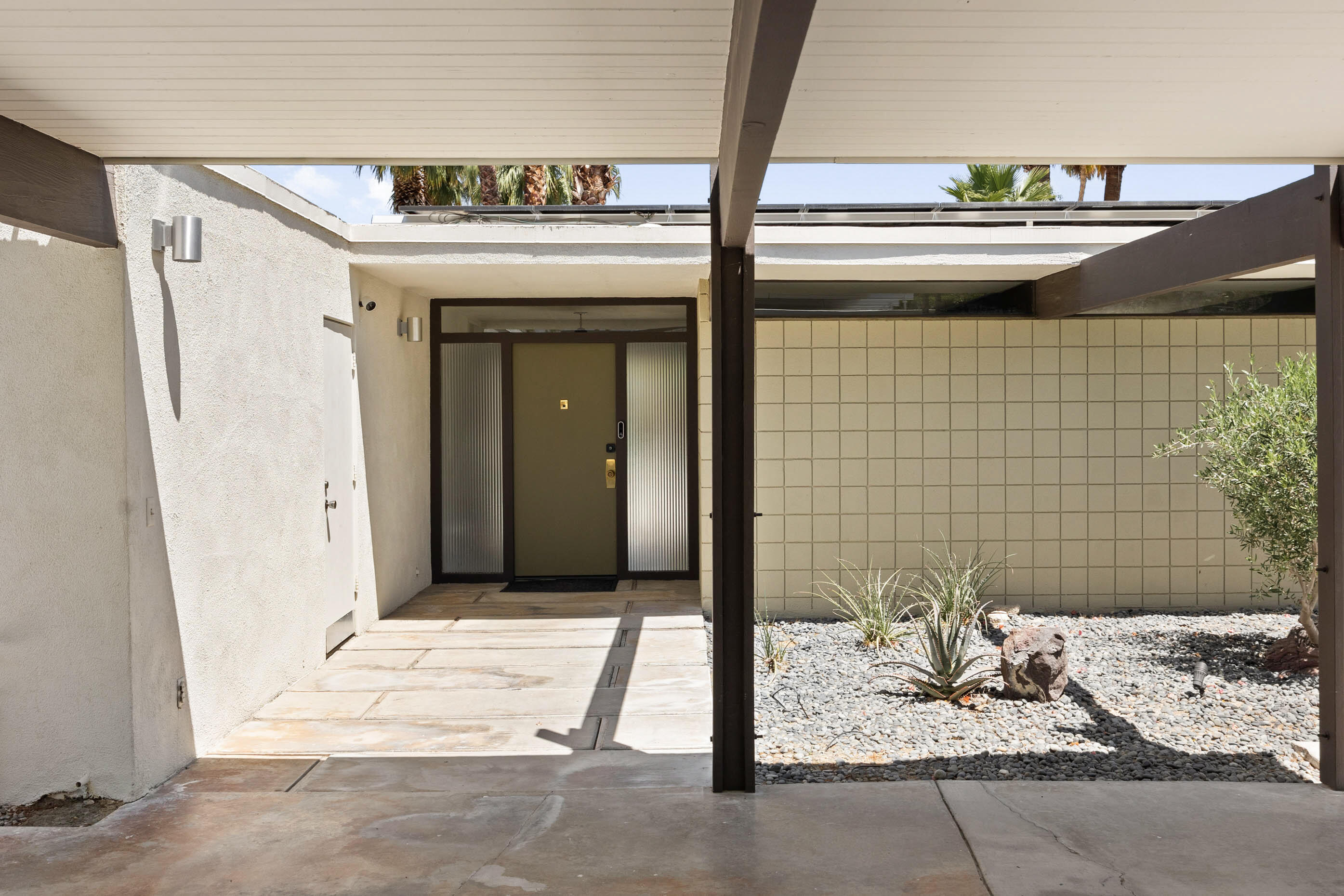 74110 Covered Wagon Trail Palm Desert, CA 92260 - Photo 4 of 44 a bathroom with a granite countertop sink and a mirror