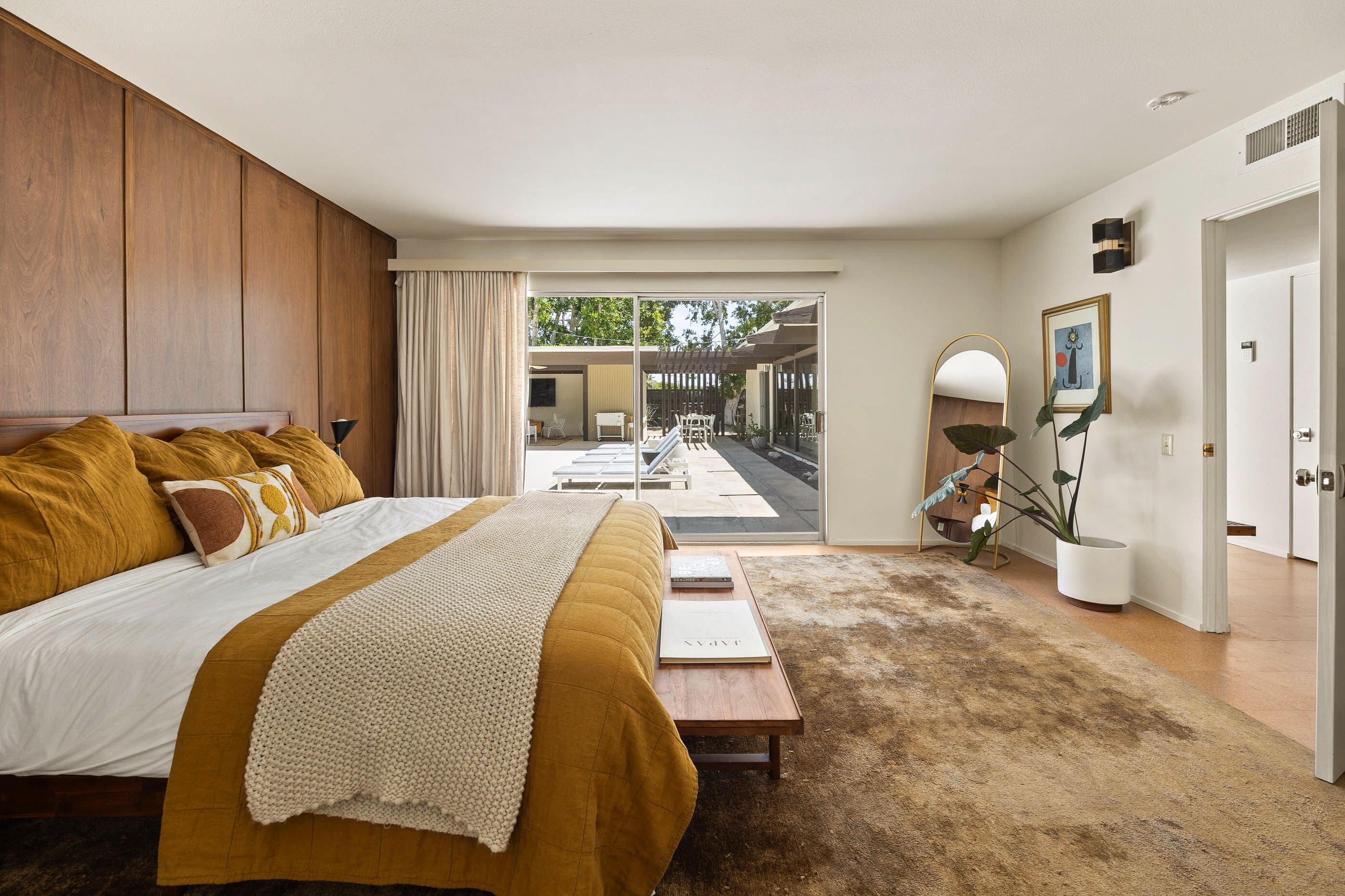 74110 Covered Wagon Trail Palm Desert, CA 92260 - Photo 41 of 44 a bedroom with a bed and large windows