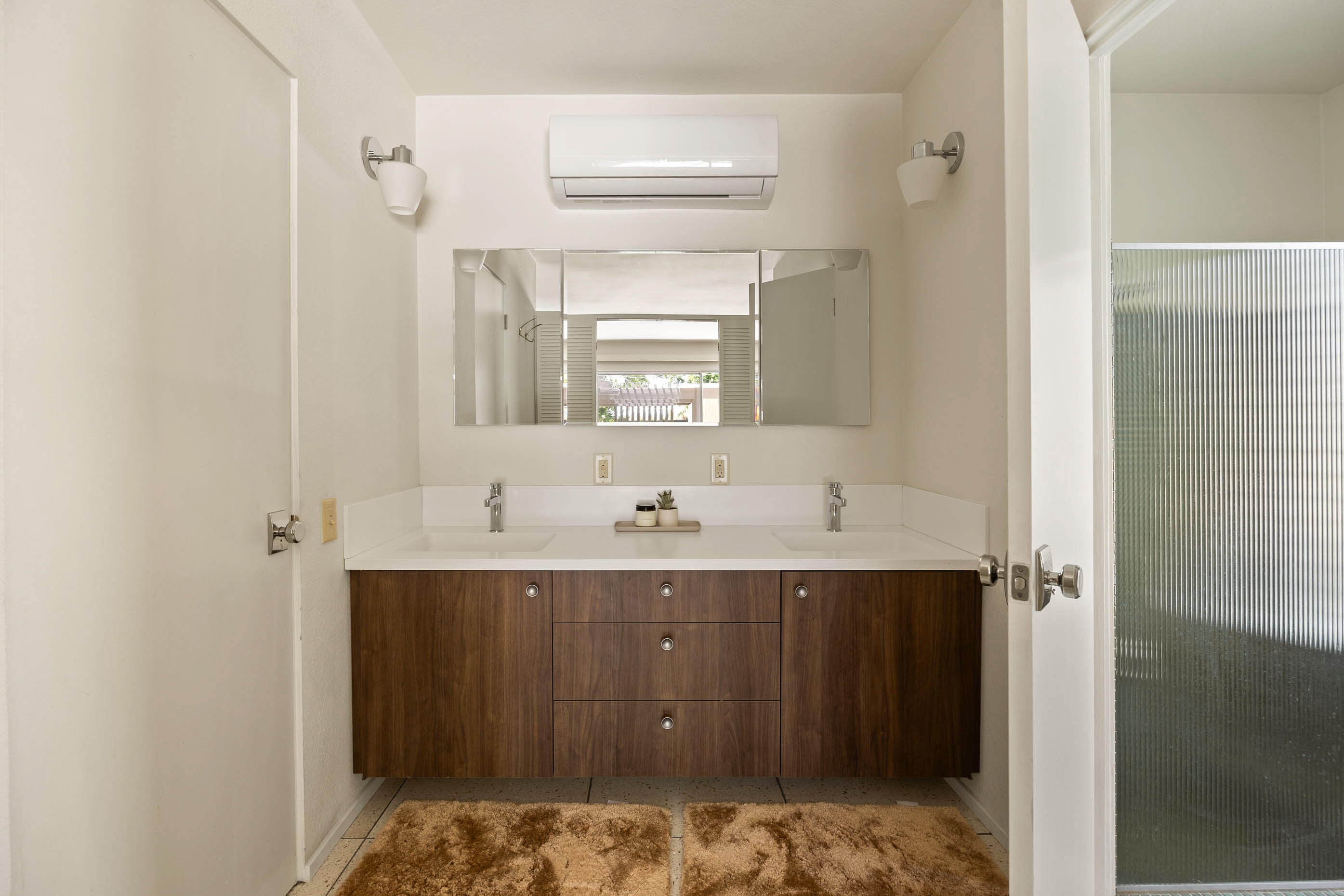 74110 Covered Wagon Trail Palm Desert, CA 92260 - Photo 42 of 44 a bathroom with a sink and a mirror