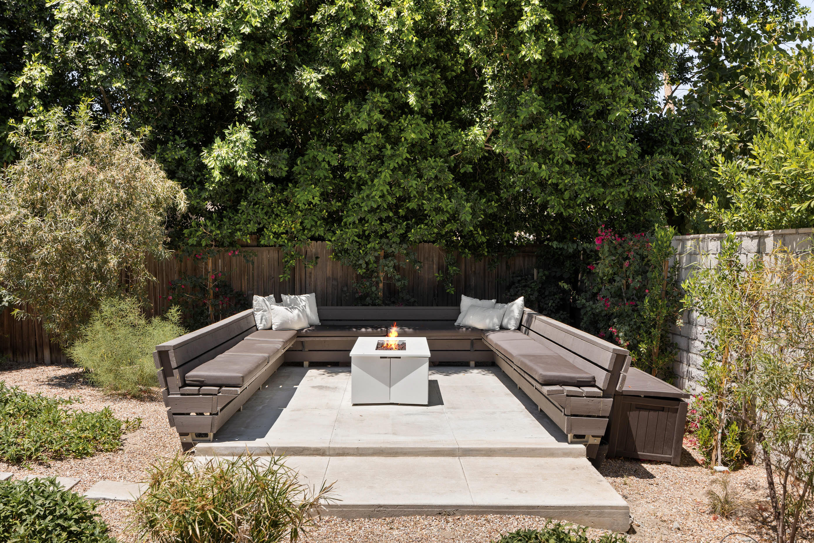 74110 Covered Wagon Trail Palm Desert, CA 92260 - Photo 9 of 44 a view of backyard with seating area and trees