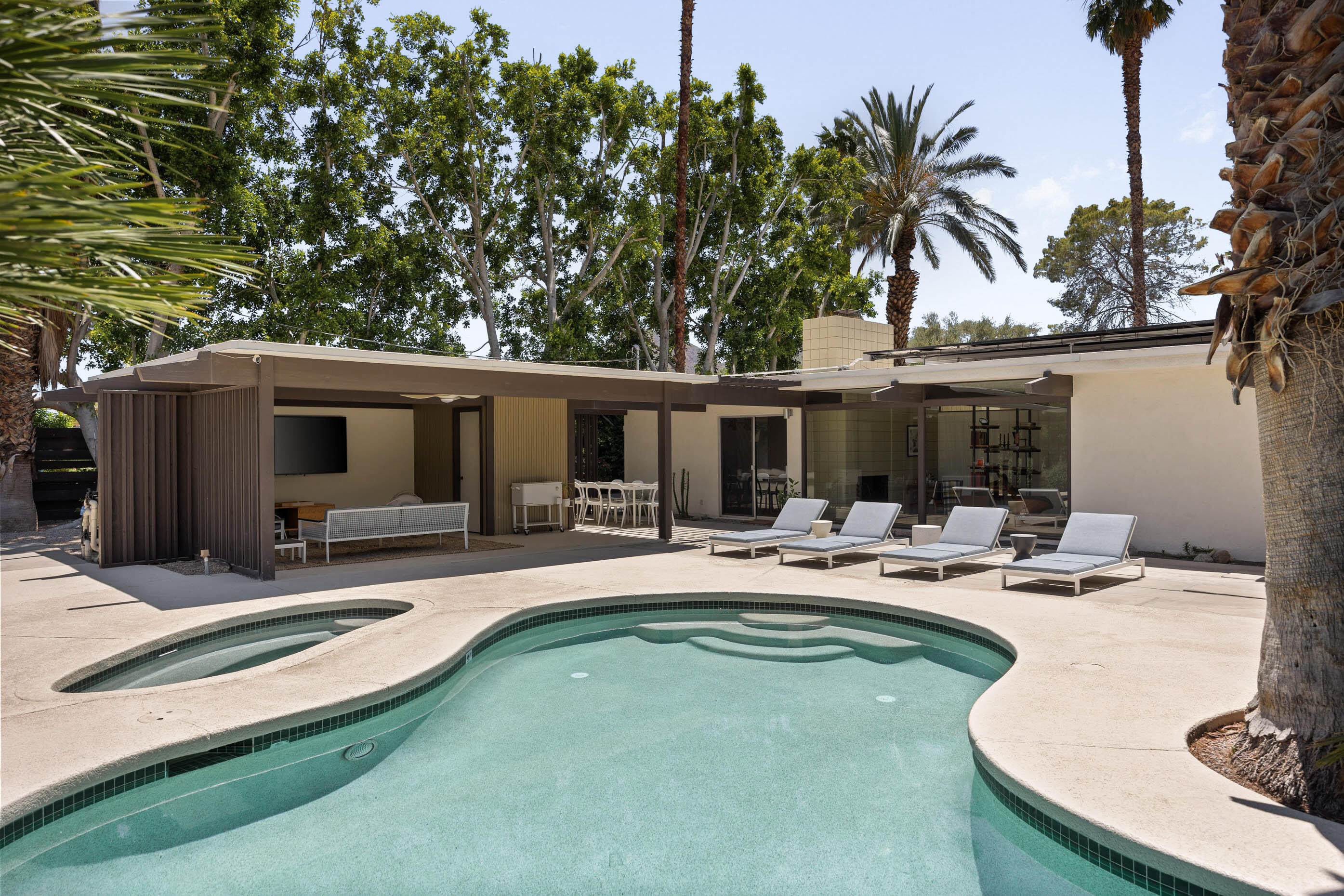 74110 Covered Wagon Trail Palm Desert, CA 92260 - Photo 10 of 44 a view of a house with swimming pool and sitting area