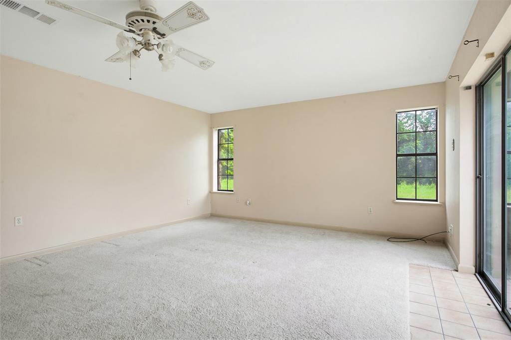 220 Green Ridge Drive Double Oak, TX 75077 - Photo 17 of 25 The primary bedroom is large enough to accomodate your king size bed.