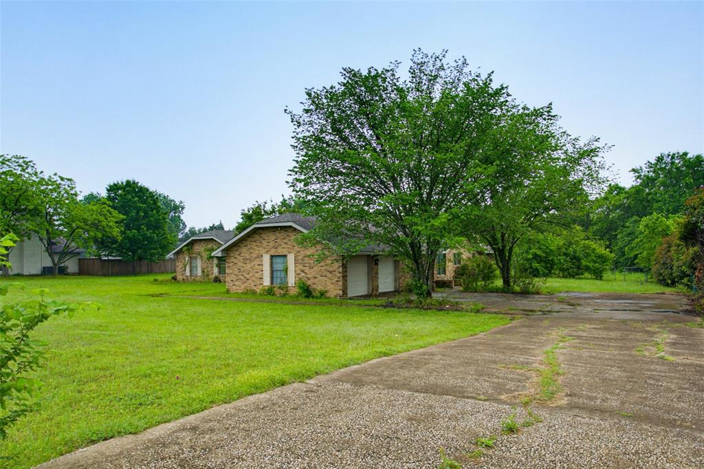 220 Green Ridge Drive Double Oak, TX 75077 - Photo 2 of 25 Side entry garage with a long driveway offers plenty of parking