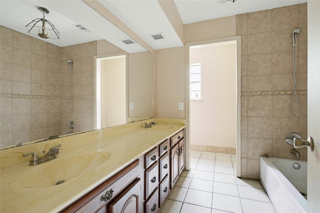 220 Green Ridge Drive Double Oak, TX 75077 - Photo 22 of 25 The guest bath offers double sinks for that morning rush.