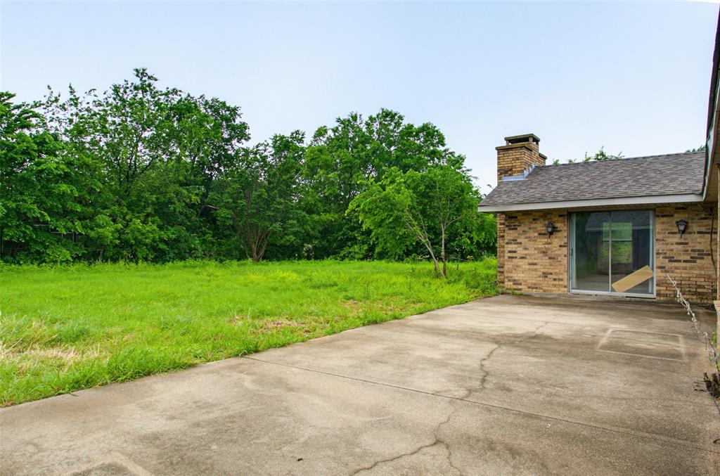 220 Green Ridge Drive Double Oak, TX 75077 - Photo 25 of 25 The mature trees and bushes provide privacy and a place for the birds to sing.