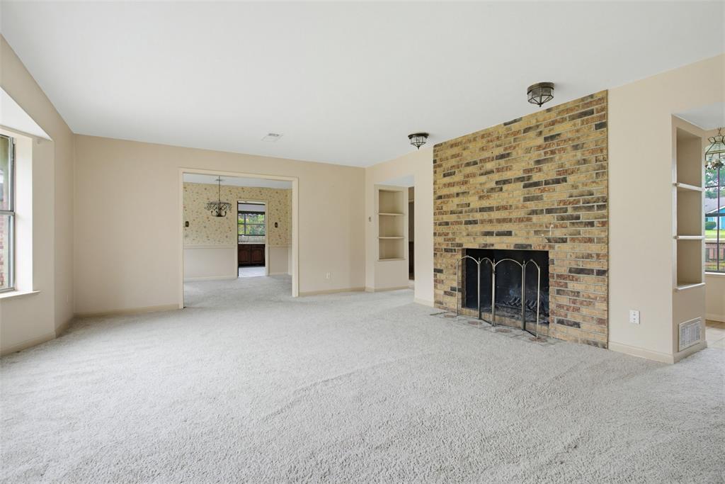 220 Green Ridge Drive Double Oak, TX 75077 - Photo 7 of 25 Opening to the dining room, your home offers plenty of space.