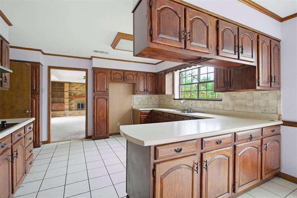 220 Green Ridge Drive Double Oak, TX 75077 - Photo 9 of 25 The chef in the family will appreciate all the cabinets in the kitchen