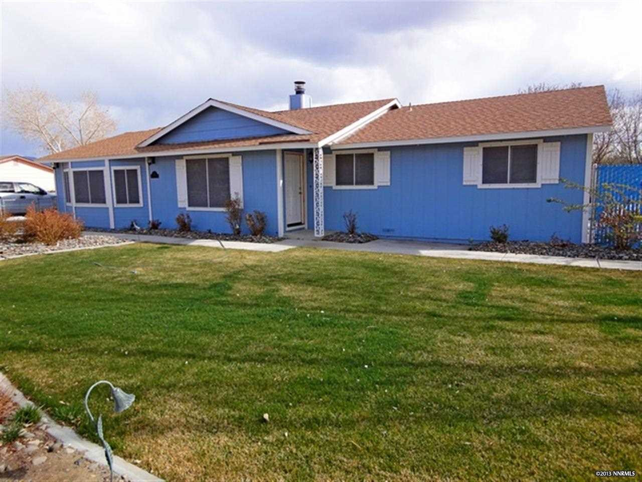 128 Ring Road Dayton, NV 89403 - Photo 1 of 1 a front view of a house with a garden